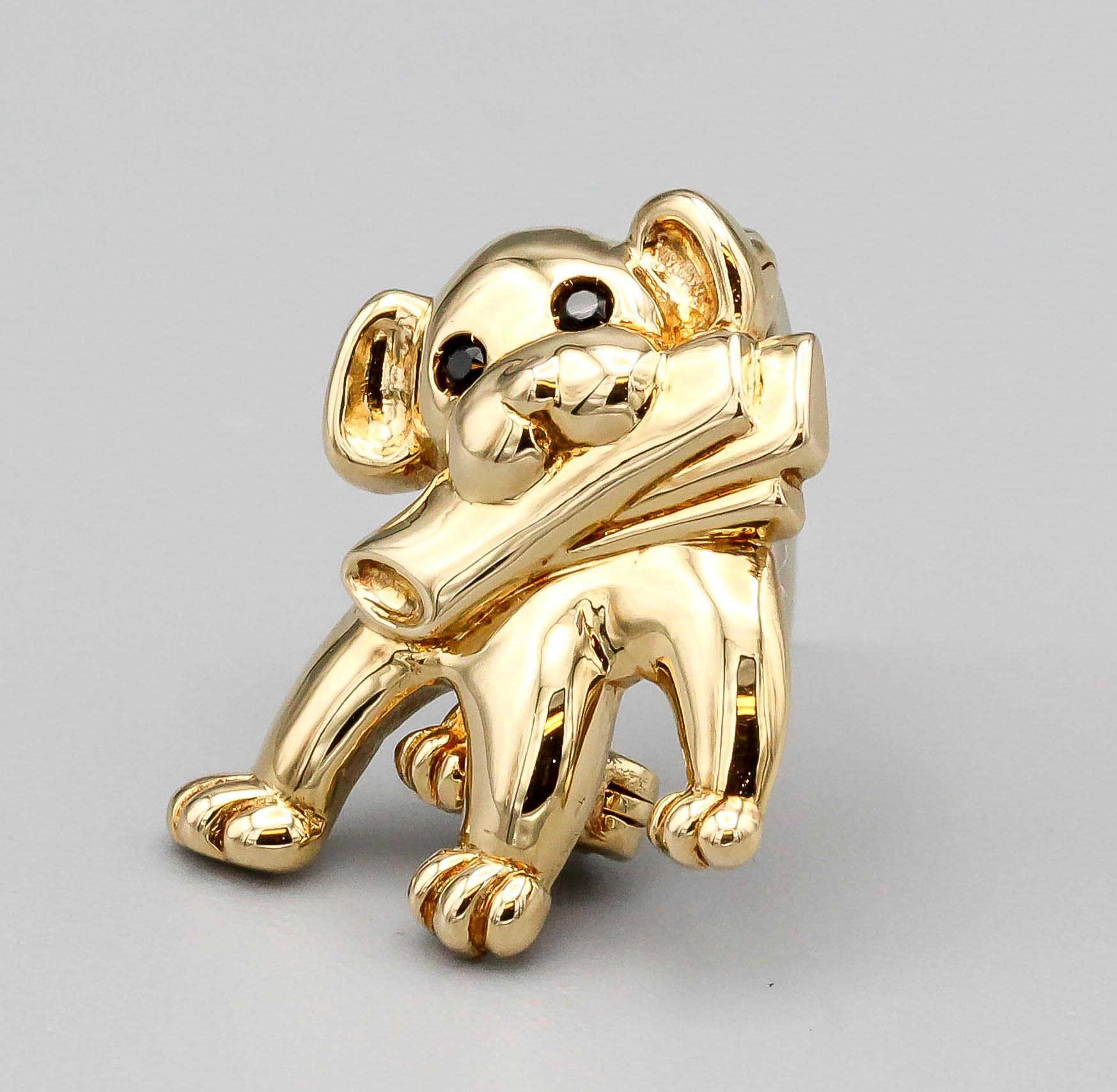 Fine and rare brooch by Van Cleef and Arpels, of French origin and circa late 20th Century.  This charming brooch is made in the likeness of a small dog with a rolled up newspaper in its mouth.  

Hallmarks: VCA 18kt reference numbers, 96, French
