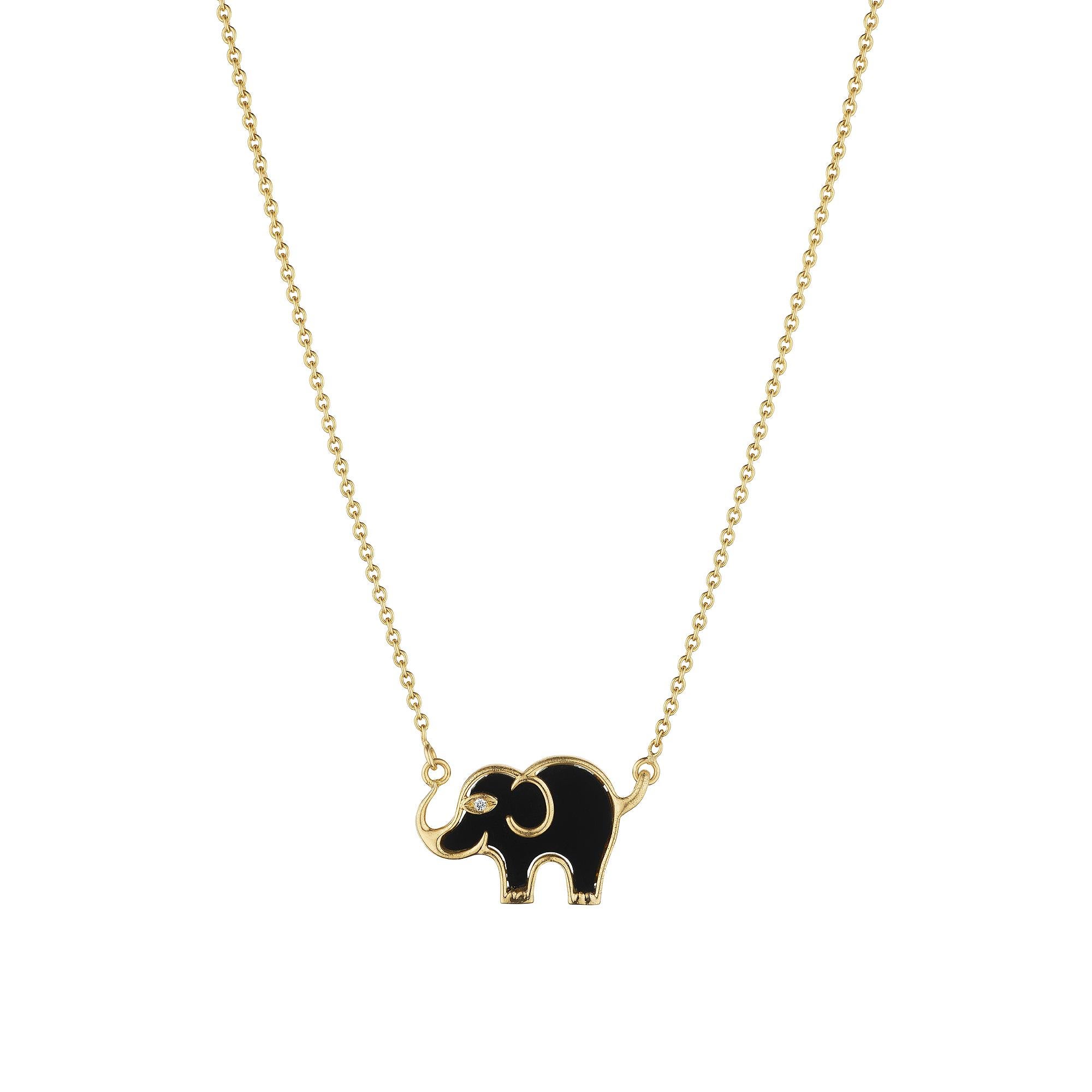 With its trunk up for luck, this Van Cleef & Arpels onyx, diamond, and 18 karat yellow gold modernist elephant pendant has you covered.  Circa 2000.  Signed VCA.  Serial number 74750.  Elephant is 1