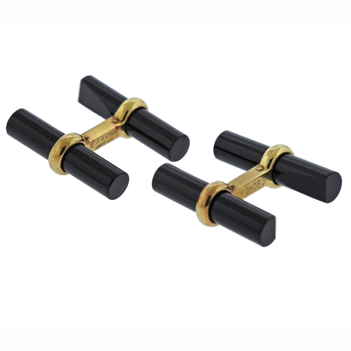 Pair of 18k yellow gold cufflinks, crafted by Van Cleef & Arpels, set with black onyx. Cufflink top measures 22mm x 6mm and weigh 8.6 grams. Marked Van Cleef & Arpels, C9040XI, 18KT.