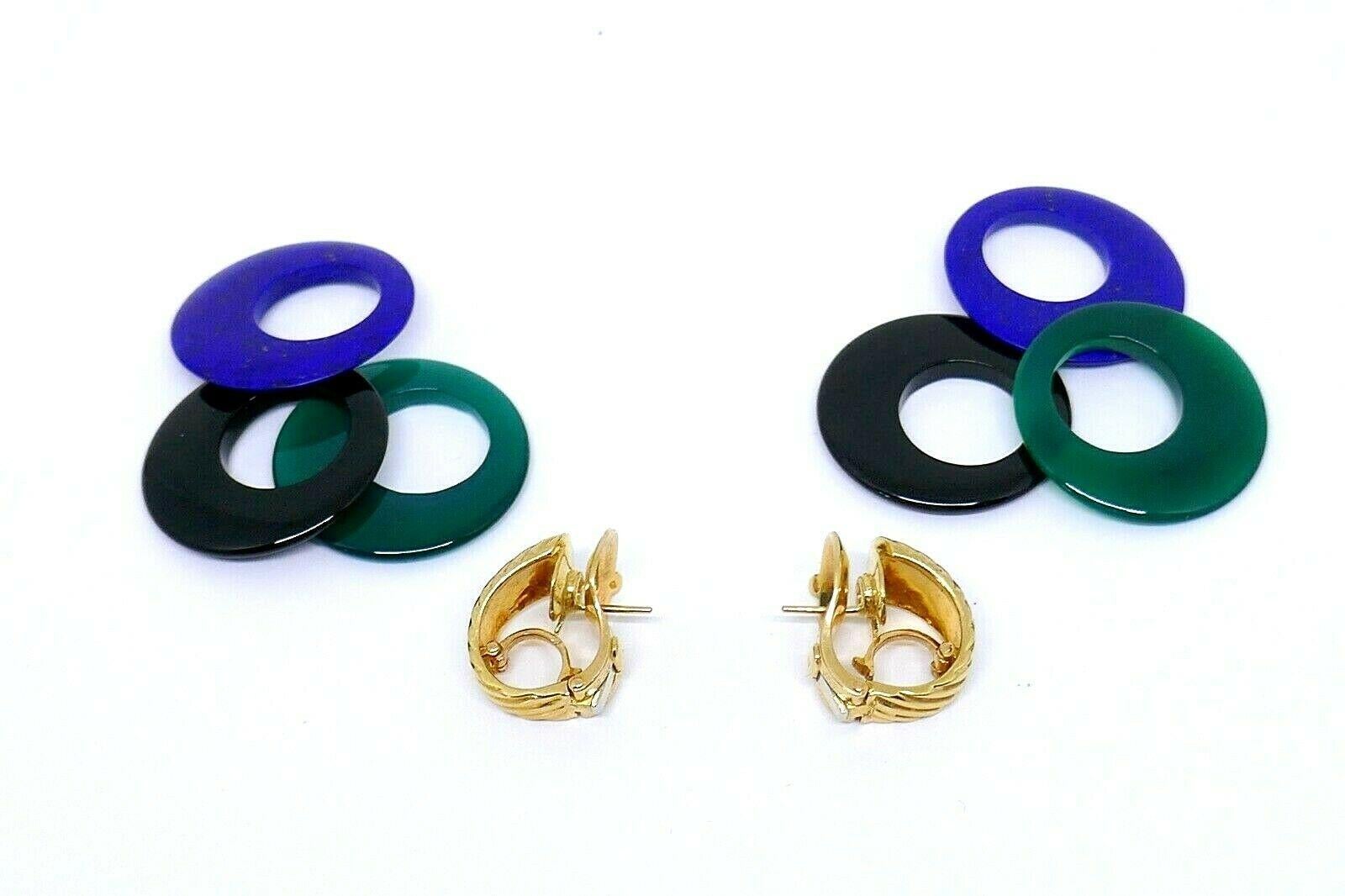 Four-in-one interchangeable vintage yellow gold earrings from Van Cleef and Arpels. 18k yellow gold shell earrings is a base for three disks that you can wear color coordinated with your attire. Onyx, lapis and malachite disks can be worn as a