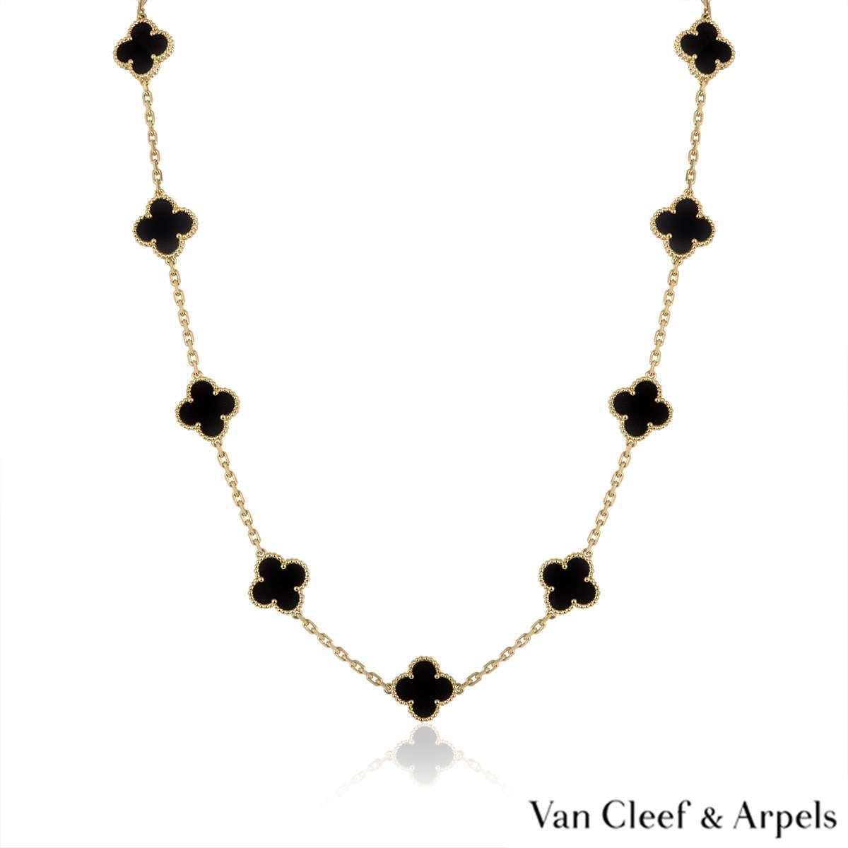 An 18k yellow gold necklace by Van Cleef & Arpels from the Vintage Alhambra collection. The necklace features 20 iconic 4 leaf clover motifs, each set with a beaded edge and an onyx inlay, set throughout the length of the chain. The trace link