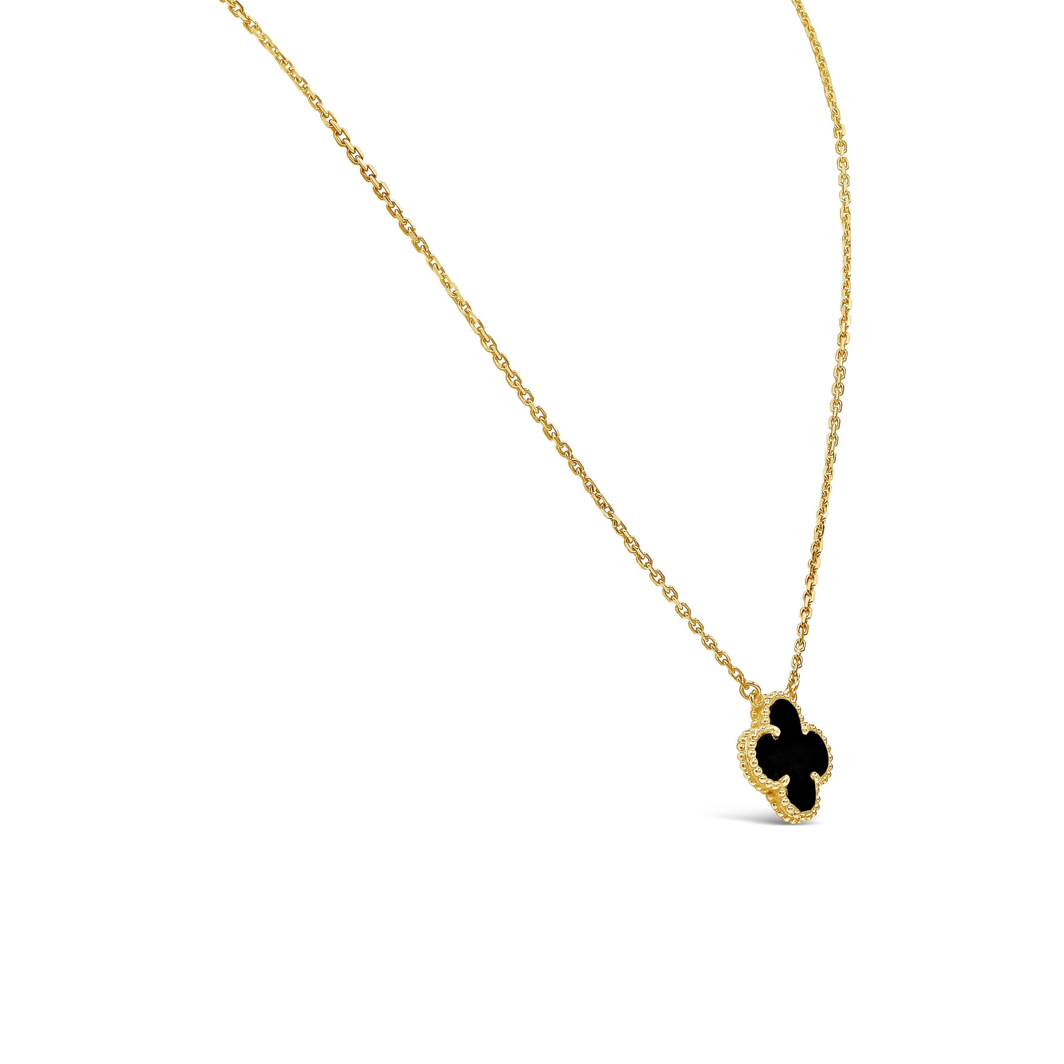 Original Alhambra pendant design made in 1968. Showcasing a four leaf clover motif pendant made of Onyx, set in a beaded mounting made in 18k yellow gold. Suspended on an original Van Cleef & Arpels yellow gold chain measuring 16 inches in length.