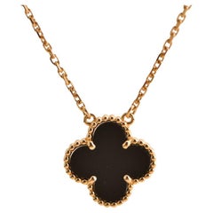 Van Cleef 
Arpels Pendentif vintage Alhambra en or jaune et onyx