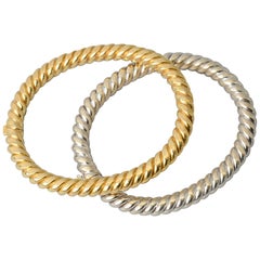 Van Cleef & Arpels Pair of Yellow and White Twisted Gold Bangle Bracelets