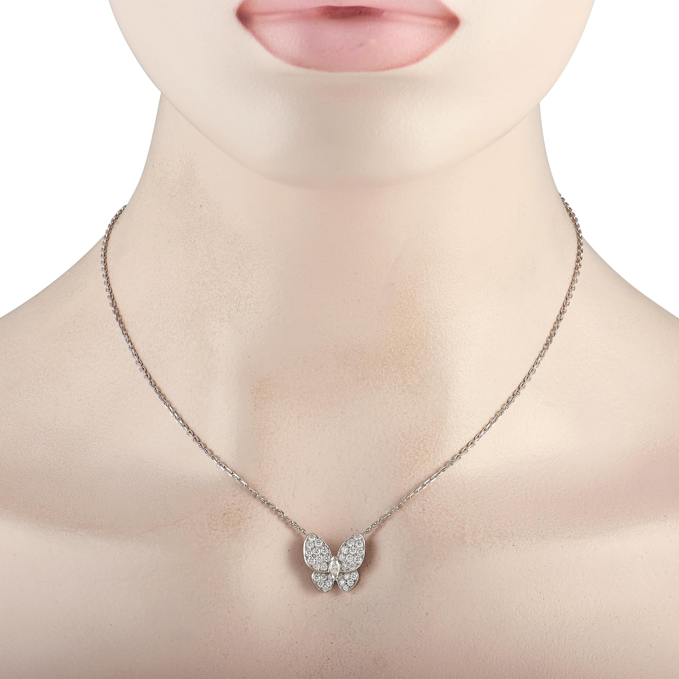 A necklace to remind you to break out of your cocoon. This beautiful Van Cleef & Arpels Papillon necklace features a stunning and sparkling butterfly pendant pavé-set with diamonds. The dainty white gold pendant hangs from a 16-inch long necklace