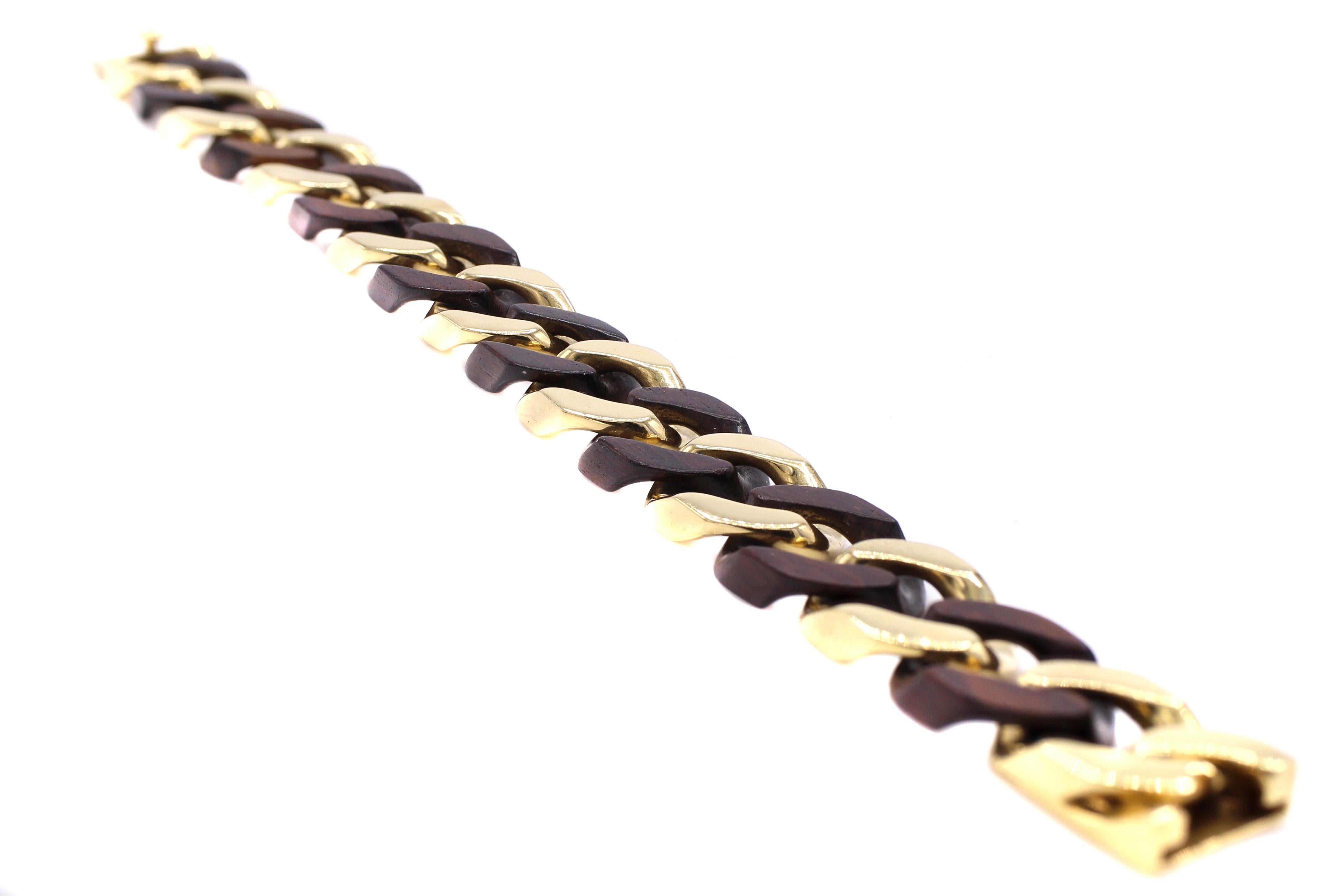 Iconic 1980s wood and 18 karat gold flat curb link bracelet by Van Cleef & Arpels Paris. Signed, numbered with French assay marks and makers marks. Length 7.75 inches