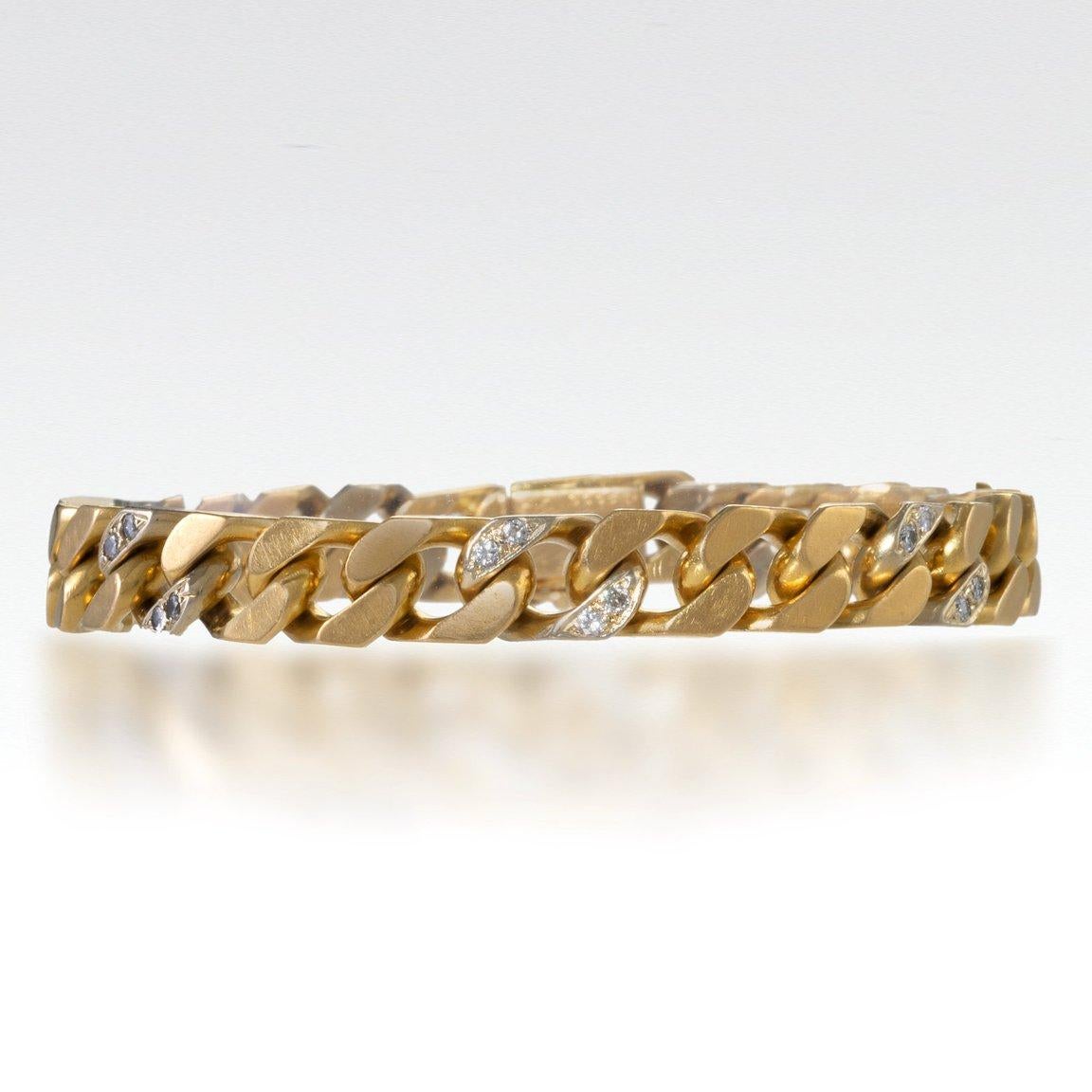 Made by Van Cleef & Arpels, Paris in the 1960s-1970s, this curb link bracelet is composed of 18K gold and diamonds. It is designed as a series of flattened 18K gold curb links highlighted at intervals by pairs of round brilliant-cut diamonds. This