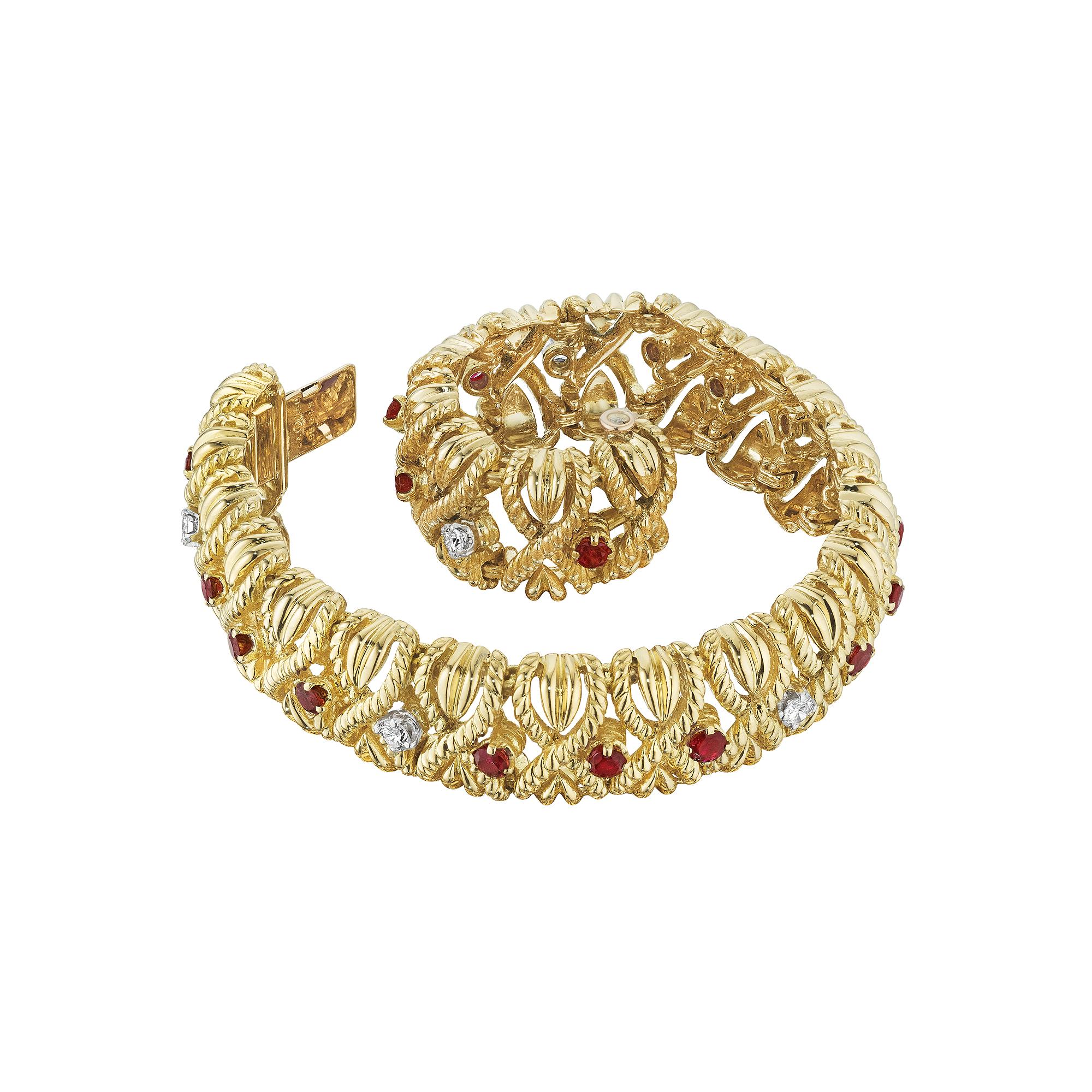 Designed by Van Cleef & Arpels Paris in 1961, this mid-century ruby and diamond gold 'X' bracelet, is the ultimate in timeless grace.  Worn alone or stacked with other bracelets, this collectible jewel is irresistible.  Circa 1961.  Total round cut