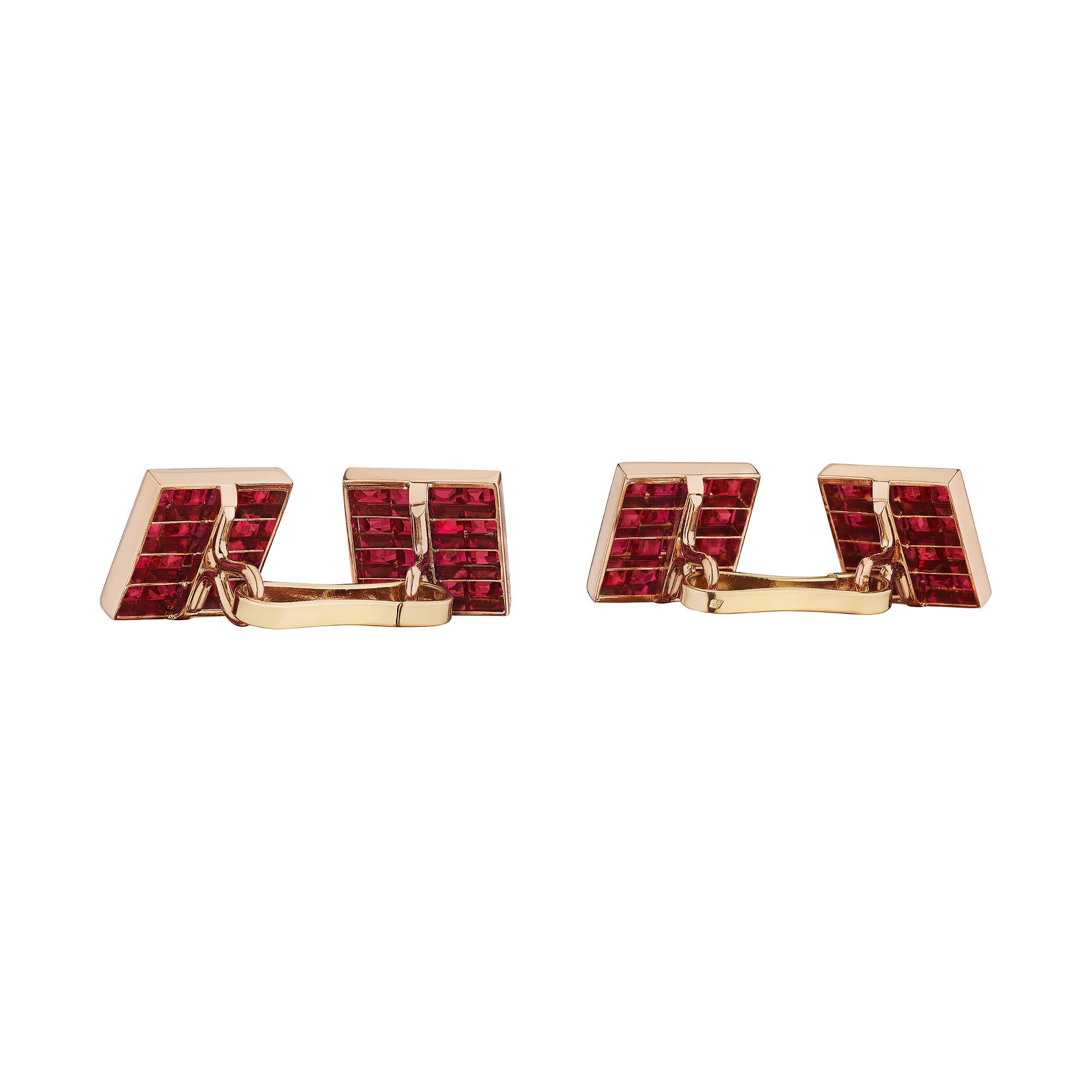 The ultimate in grace and sophistication, these Van Cleef & Arpels Paris modernist invisibly set square cut ruby rose gold cufflinks are simply immersive.  This stunning pair of cufflinks contains 64 square cut invisibly set vivid red rubies,