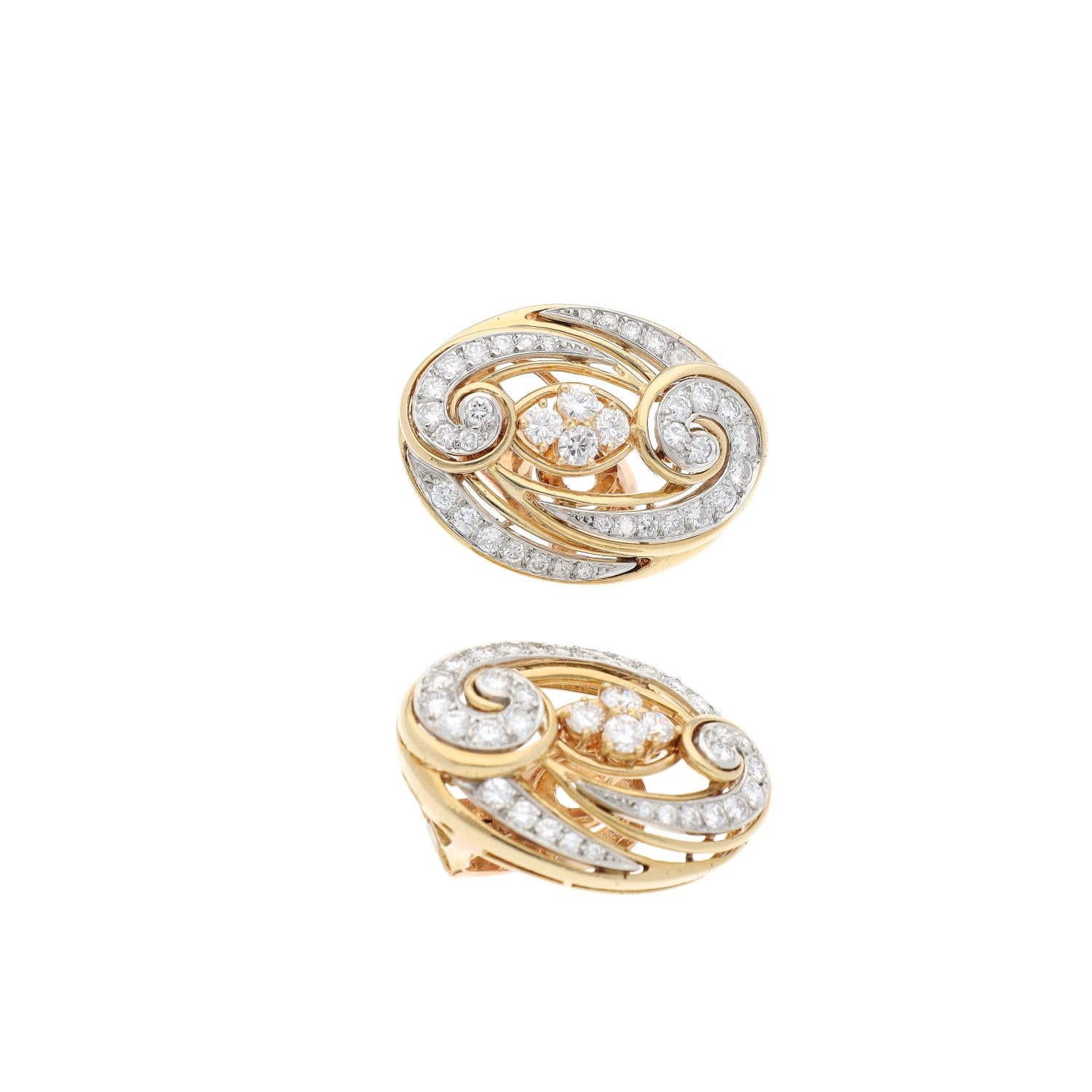 Van Cleef & Arpels Paris Vintage Collection Diamond Gold Arabesque Earclips

From our Signed Vintage Jewels Collection a pair of diamond gold Arabesque 1970s Van Cleef & Arpels Paris elegant diamond and platinum set 18kt gold earrings made in Paris