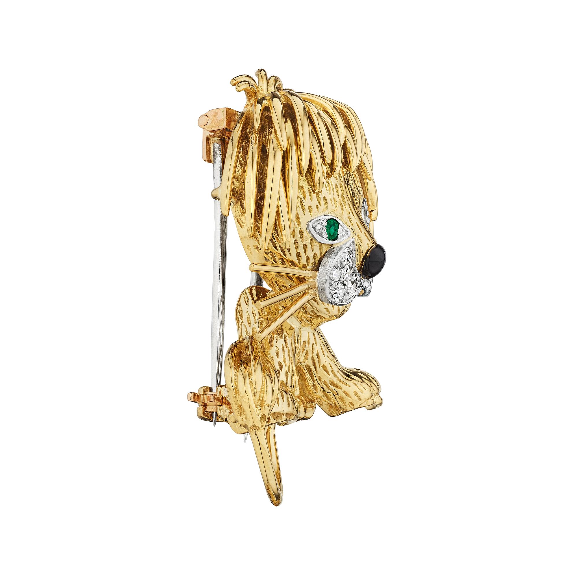 Keep your baby lion cub close to you when wearing this adorable Van Cleef & Arpels Paris vintage diamond emerald gold and platinum brooch. With its black enamel nose, emerald eyes, and diamond face, this frisky lion cub will keep you purring. Signed