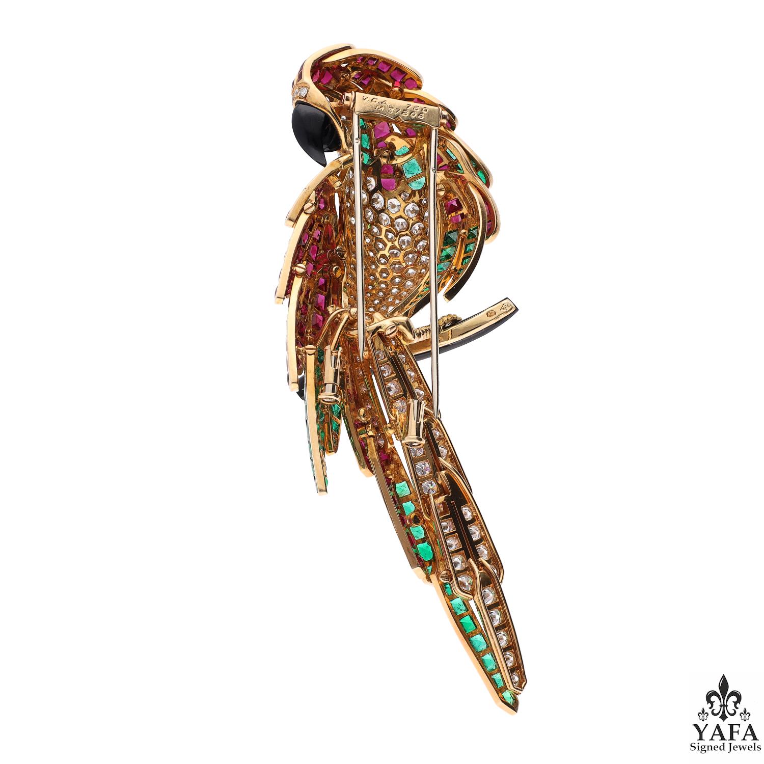 Van Cleef & Arpels Paris Vintage Collection Multi Gem Diamond Parrot of Splendor Brooch

Van Cleef & Arpels mastered the art of precious birds in flight in the early 1920s.  No Parisian Maison has excelled so much since. Our 18kt yellow gold