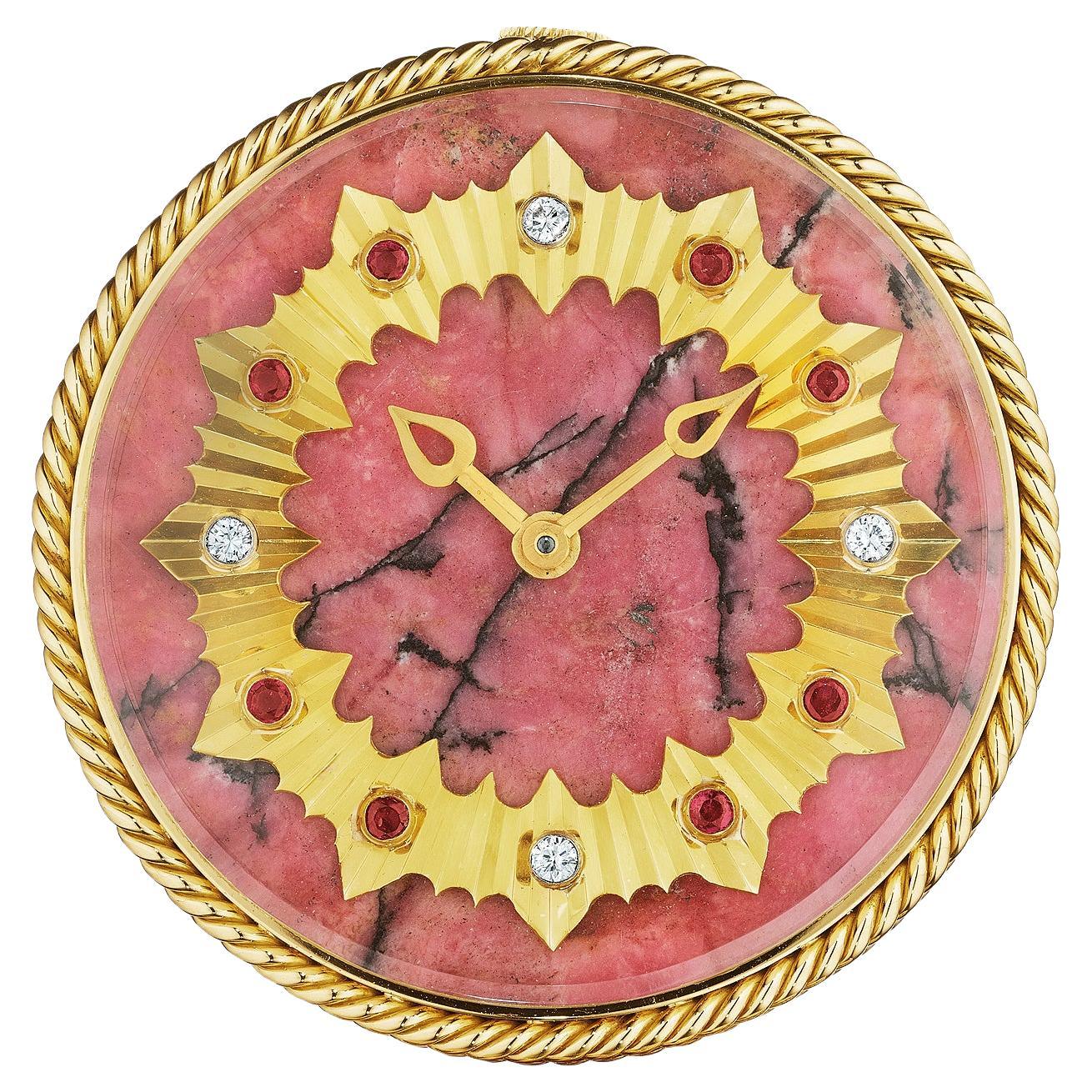 It is said that time is a luxury and this sumptuous Van Cleef & Arpels Paris vintage desk clock is the ultimate reminder.  With a lush pink rhodonite crystal face featuring a 18 karat yellow gold circular ruby and diamond encrusted crown, this clock