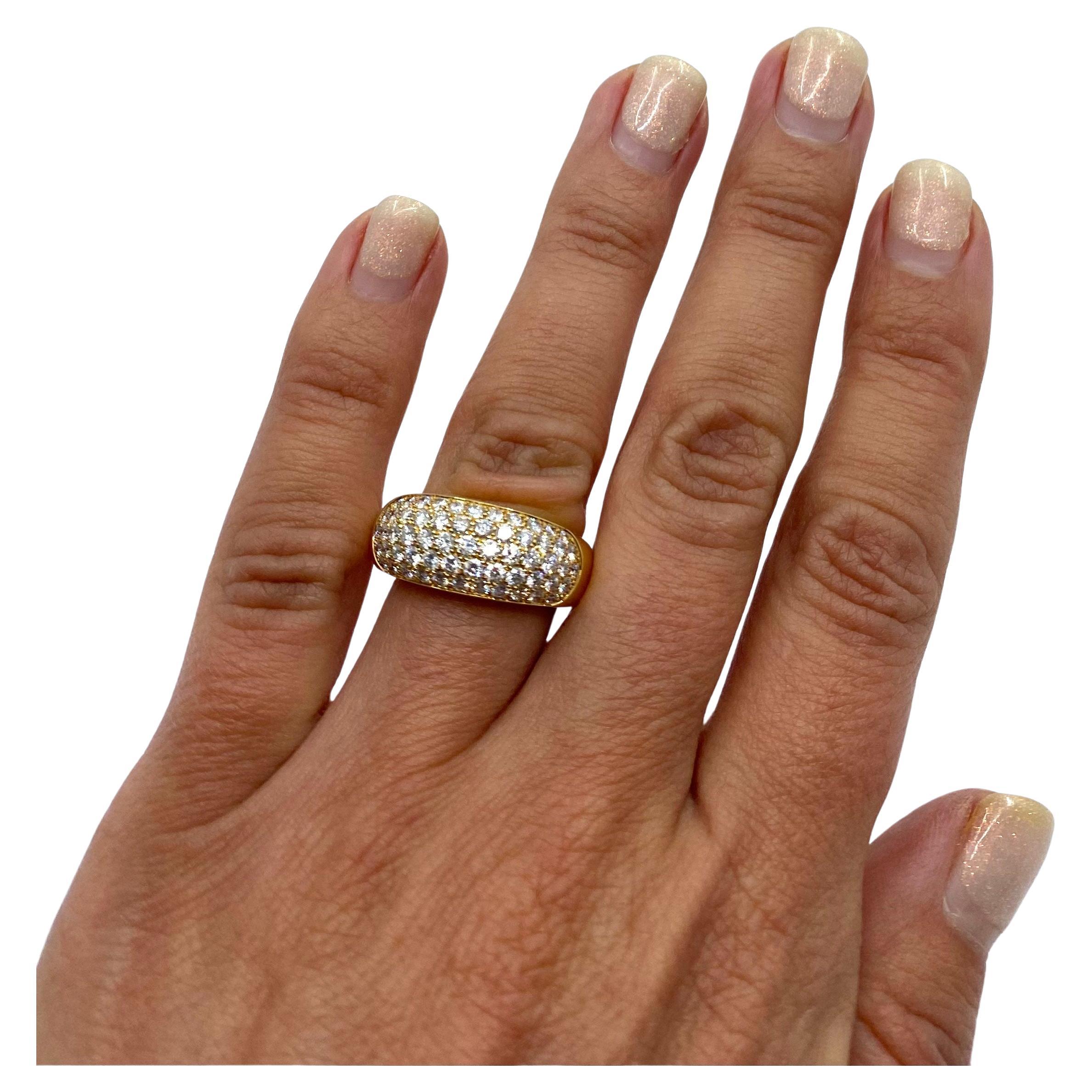 A classic Van Cleef & Arpels pave diamond 18k gold dome ring.  The dome has angled corners with the diamonds set in four rows. This design called “a boule ring”, which stands for the rings with a domed head embellished with pave gems. The term came