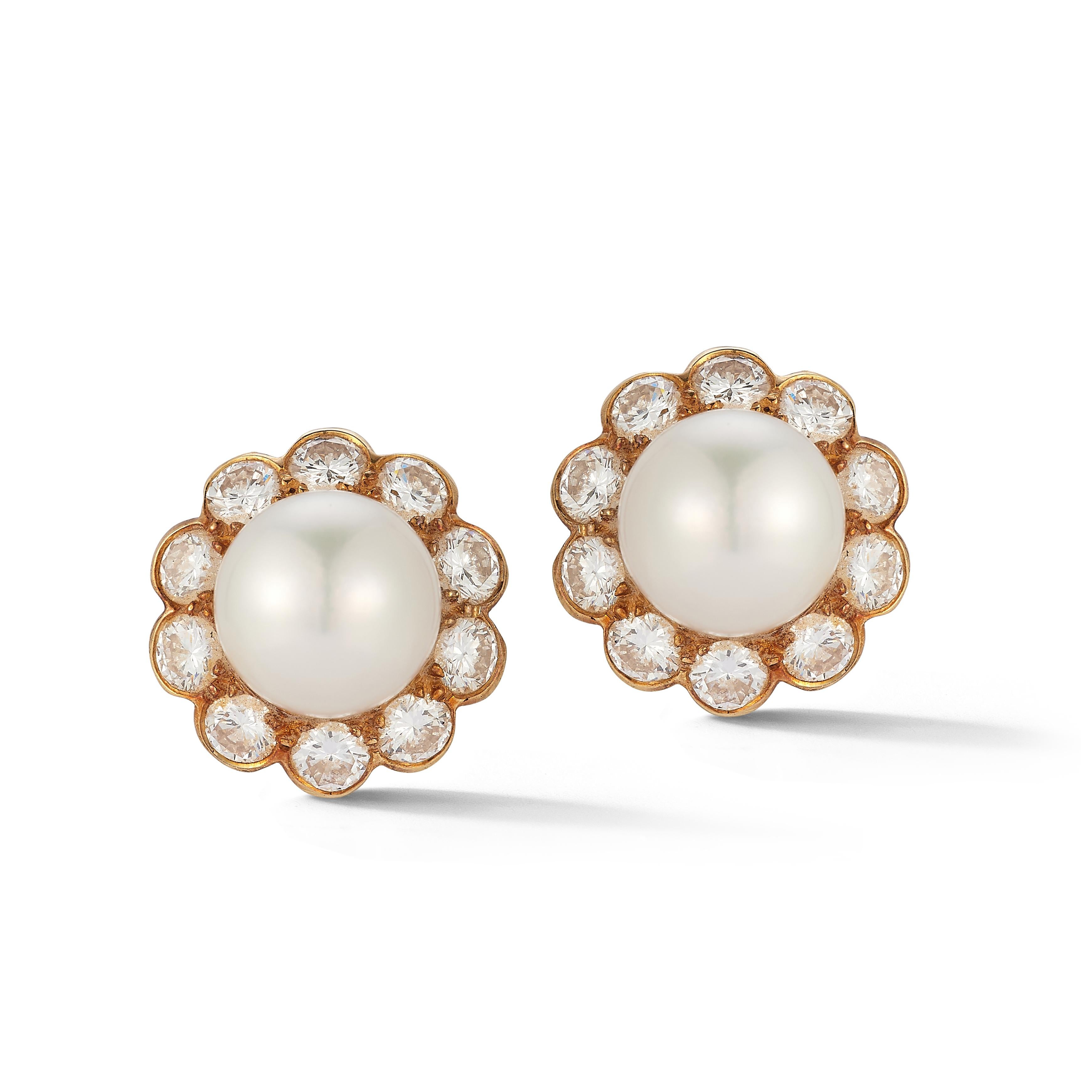 Van Cleef & Arpels Pearl & Diamond Earrings

 A pair of earrings consisting of 1 center pearl surrounded by round cut diamonds forming a flower motif.

Measurements: .50