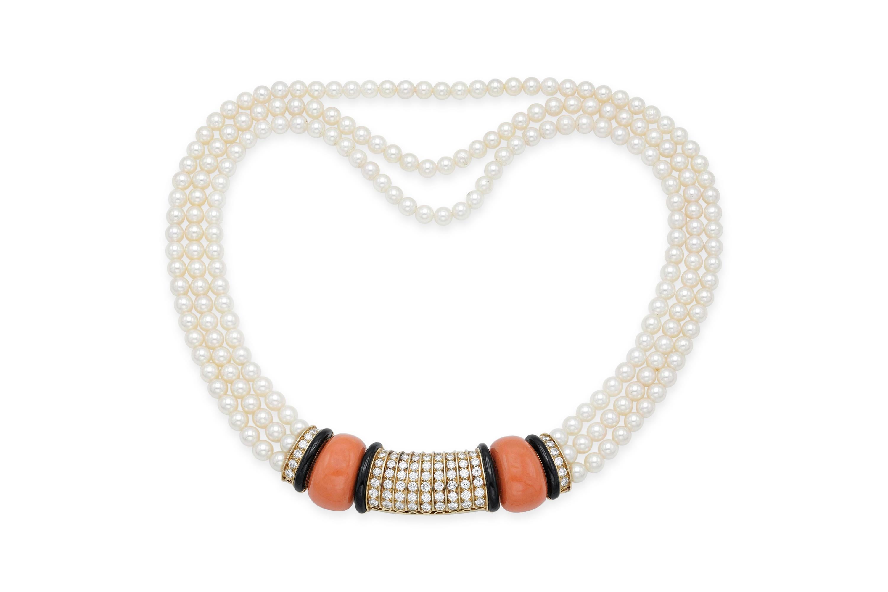 Finely crafted in 18k yellow gold with three strands of pearls, coral, onyx, and approximately 6.00 carats of Round Brilliant cut diamonds.
Signed by Van Cleef & Arpels.
Circa 1960s.