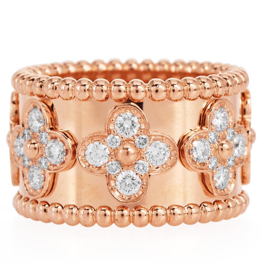 Beautiful timeless creation from the world-renowned house of Van Cleef and Arpels. Presenting a very popular VCA Perlée ring crafted in 18K Rose Gold lined with beaded edges. Set with their clover motifs in eternity studded with natural Diamonds to
