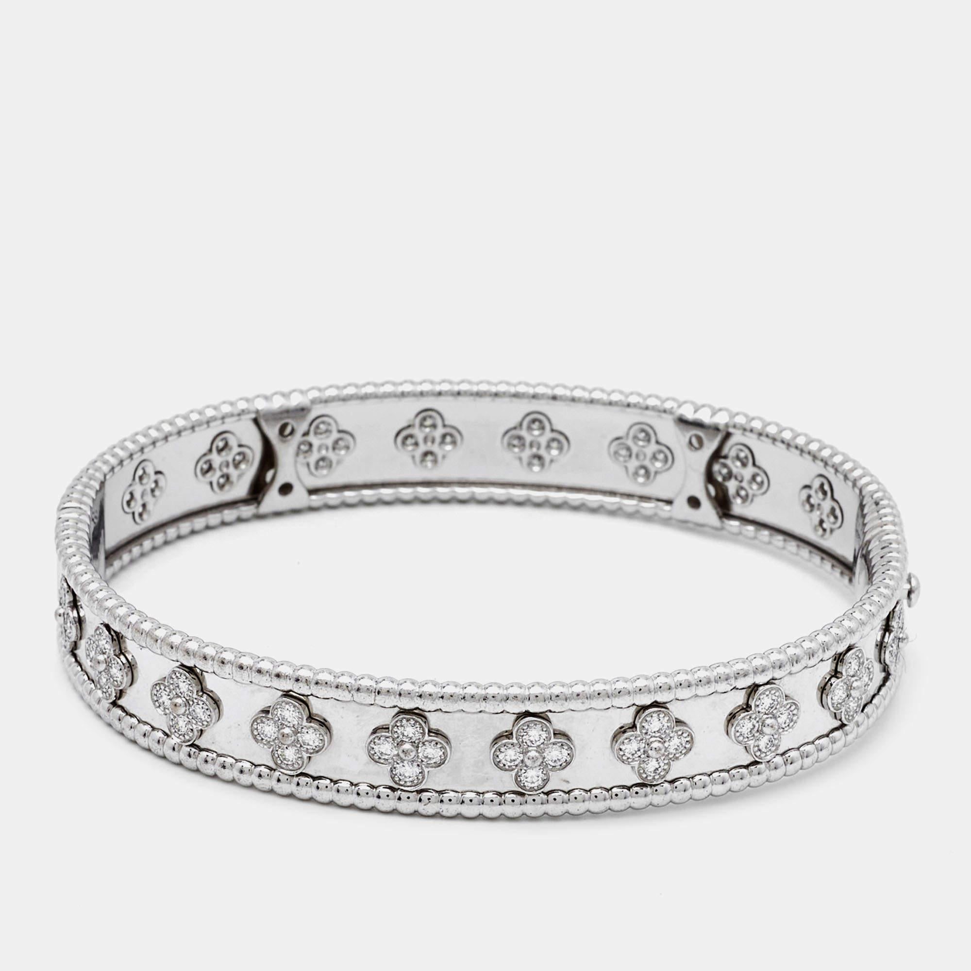 This designer bracelet comes sculpted from 18k white gold and is highlighted by shimmering diamonds. Smoothly finished, the desirable creation deserves to be on your wrist.

