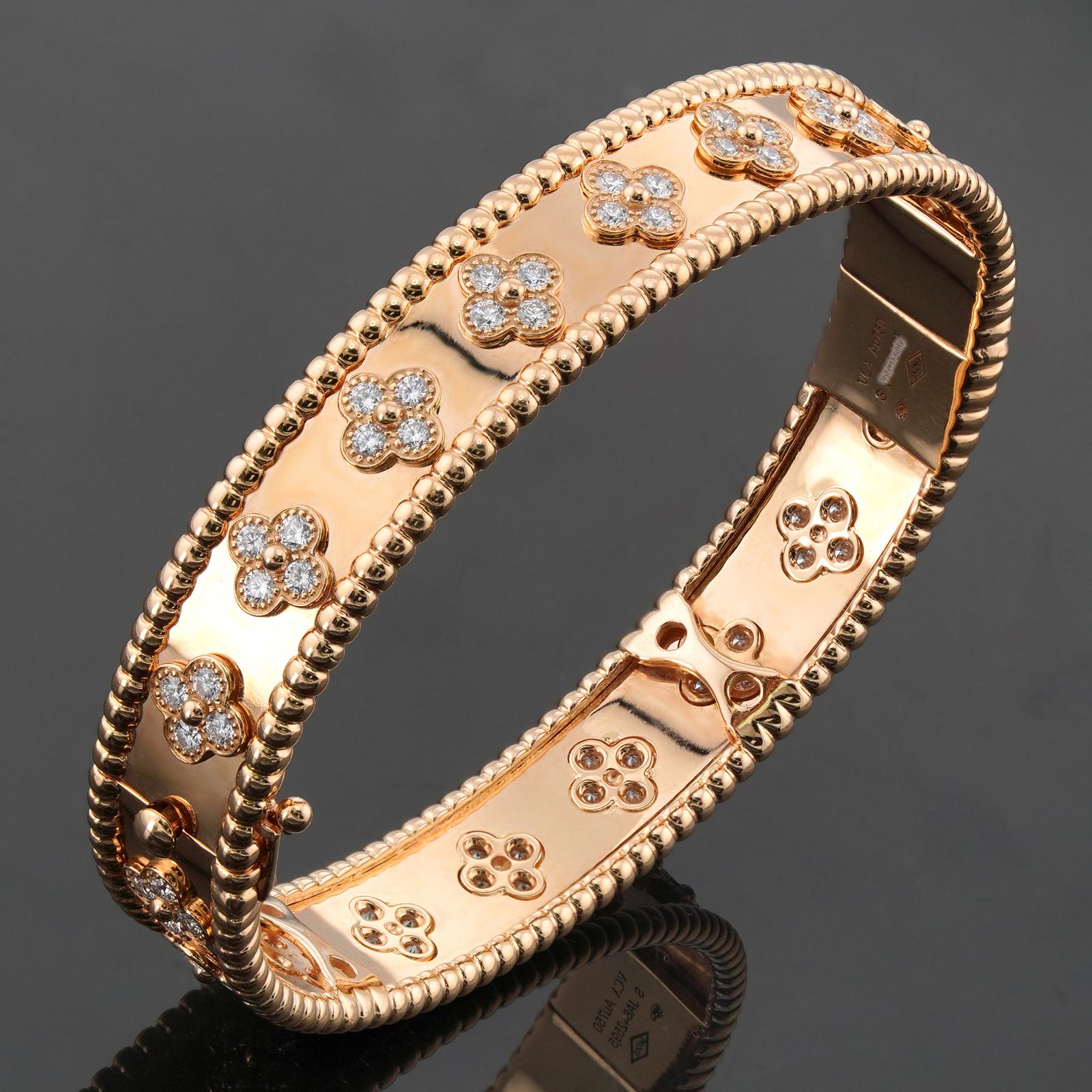 This gorgeous Van Cleef & Arpels bangle features a floral motif with a beaded border and is crafted in 18k yellow gold and accented with 80 round brilliant D-E-F diamonds weighing an estimated 1.78 carats. Made in France circa 2020s. Measurements: