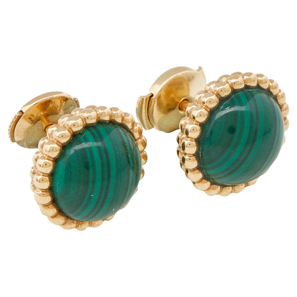 The luxury and charm of these Van Cleef & Arpels earrings in 18K yellow gold is bound to leave anyone mesmerized. The contours of these round-shaped studs are beautifully structured in a bead-like formation with malachite sitting at the center.