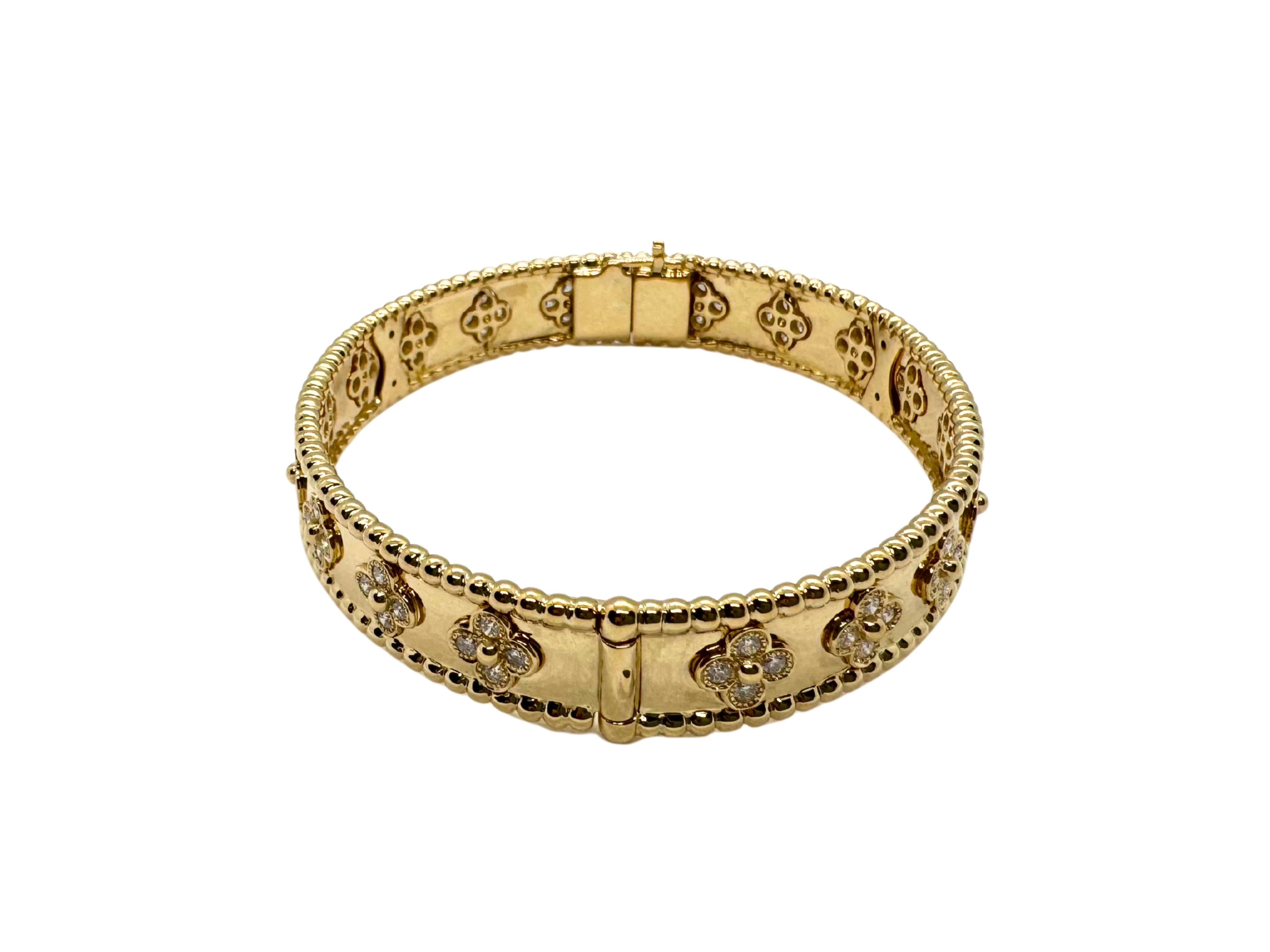 Van Cleef & Arpels Perlée Diamond Clover 18 Karat Yellow Gold Bangle Bracelet In Good Condition For Sale In Oakton, VA