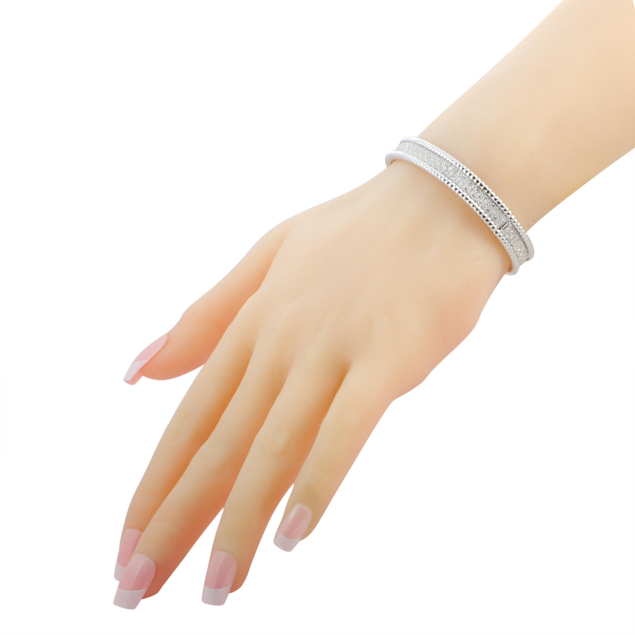 The “Perlée” bracelet by Van Cleef & Arpels is made out of 18K white gold and diamonds and weighs 41.2 grams. The bracelet measures 7.85” in length, boasting a 2.50” diameter. Size Medium.

This jewelry piece is offered in estate condition and