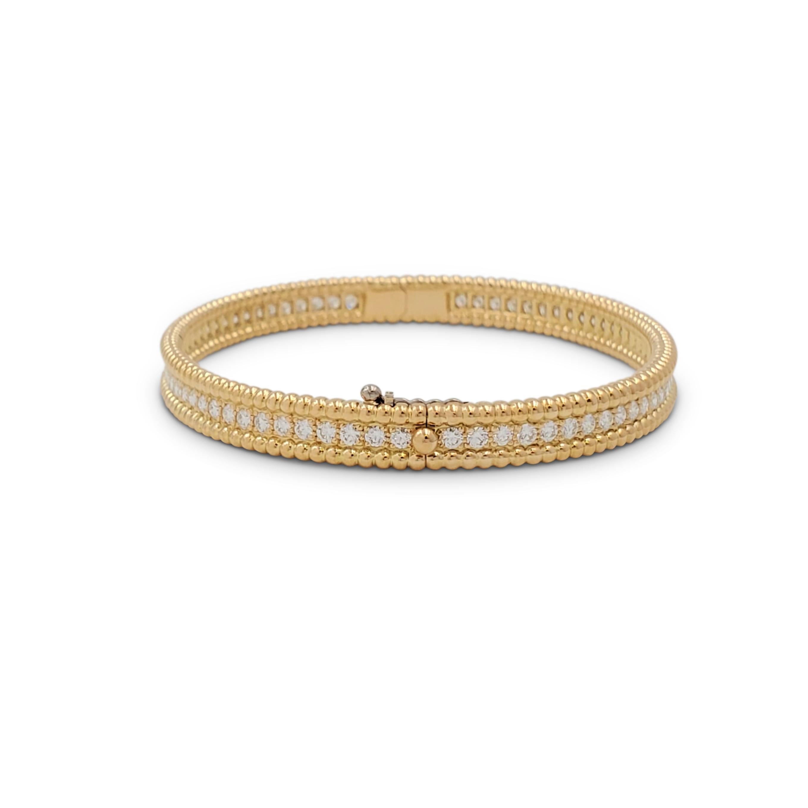 Authentic Van Cleef & Arpels 'Perlée' bracelet crafted in 18 karat yellow gold features a single row of high-quality round brilliant cut diamonds weighing an estimated 2.16 carats total weight (E-F, VS).  Signed VCA, Au750, M, with serial number.