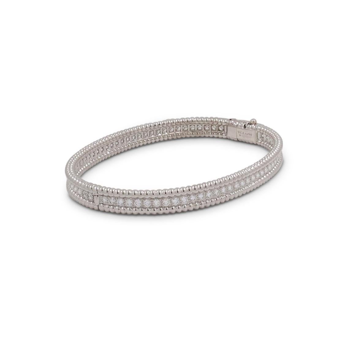 Authentic Van Cleef & Arpels 'Perlée' bracelet crafted in 18 karat white gold features a single row of high-quality round brilliant cut diamonds weighing an estimated 2.16 carats total weight (E-F, VS). Signed VCA, Au750, M, with serial number. The