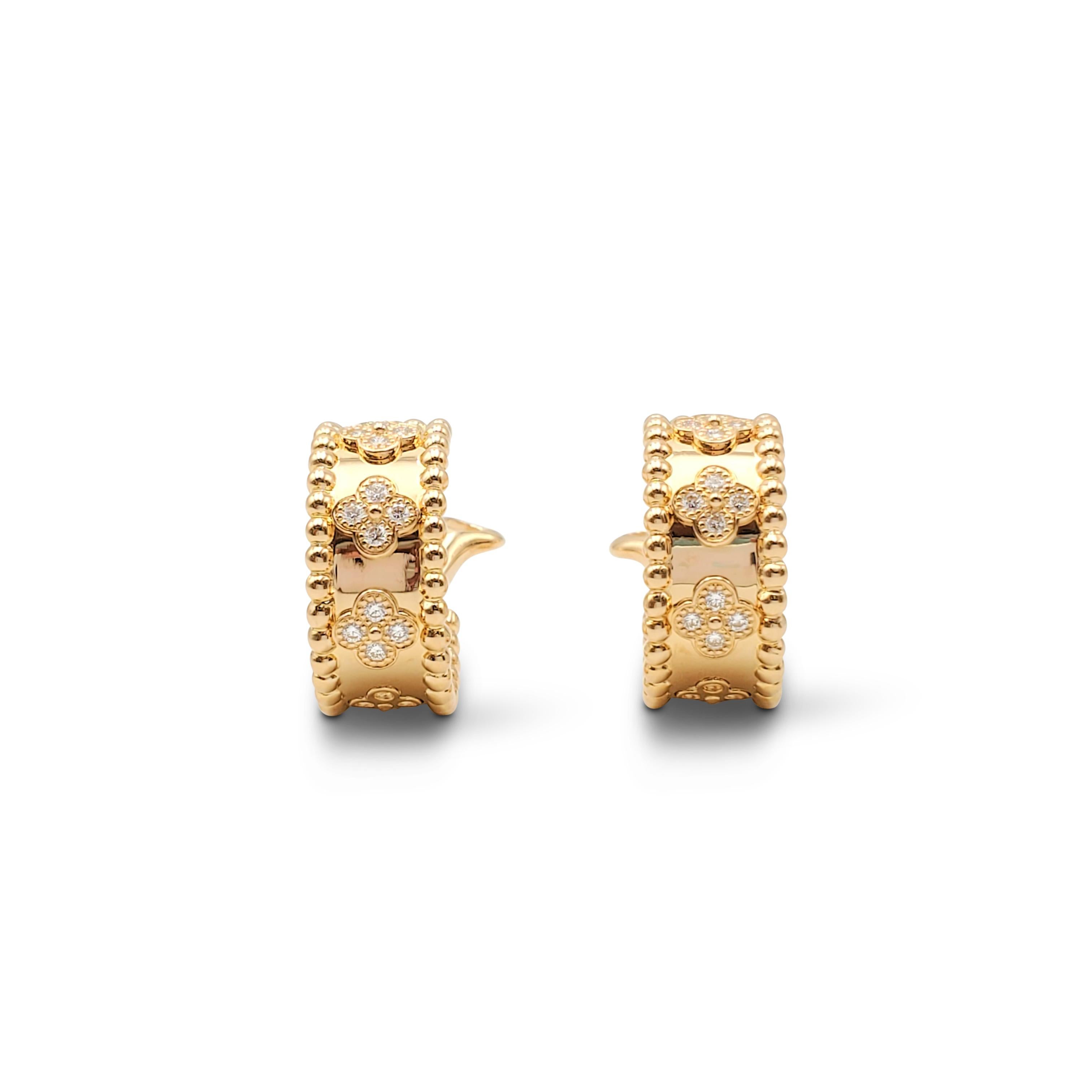 Authentic pair of Van Cleef & Arpels Perlée earrings crafted in 18 karat yellow gold featuring five sections of clovers set with round brilliant cut diamonds (E-F color, VS clarity) weighing an estimated 0.80 carats total. Signed VCA, Au750, with