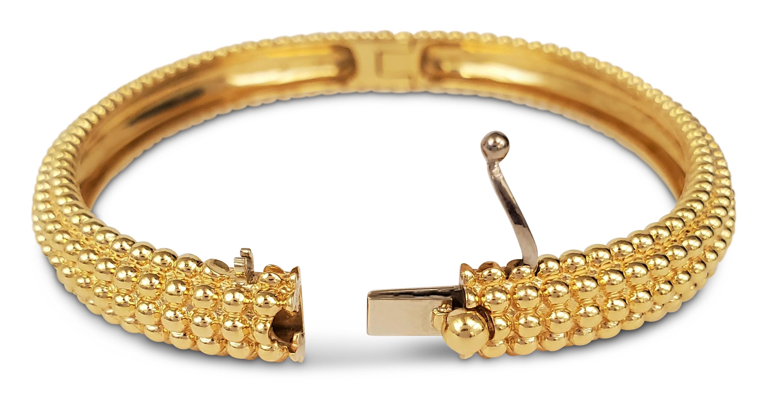 Authentic Van Cleef & Arpels Perlée 5-row bangle crafted in beaded 18 karat yellow gold.  Signed VCA, Au750, M, with serial number. Size M (6 1/2 inch diameter). The bangle is not presented with original box or papers. CIRCA 2010s. 