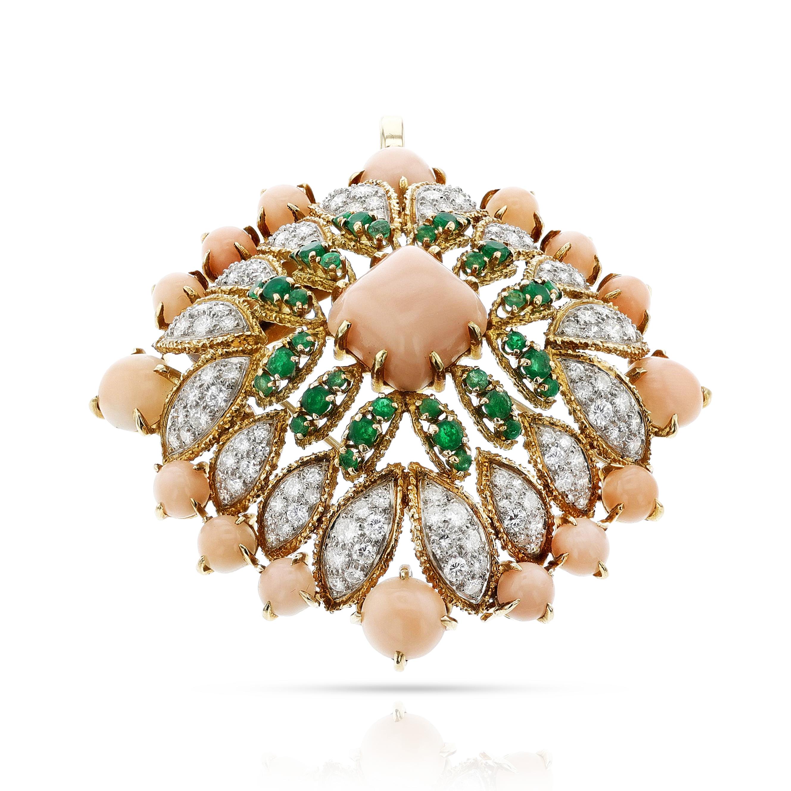 A Van Cleef & Arpels Péry et Fils Coral, Emerald and Diamond Pendant Brooch made in France. The brooch has a large central coral cabochon surrounded by emeralds, diamonds, coral cabochons. The brooch has a double pin fitting and a hinged suspension