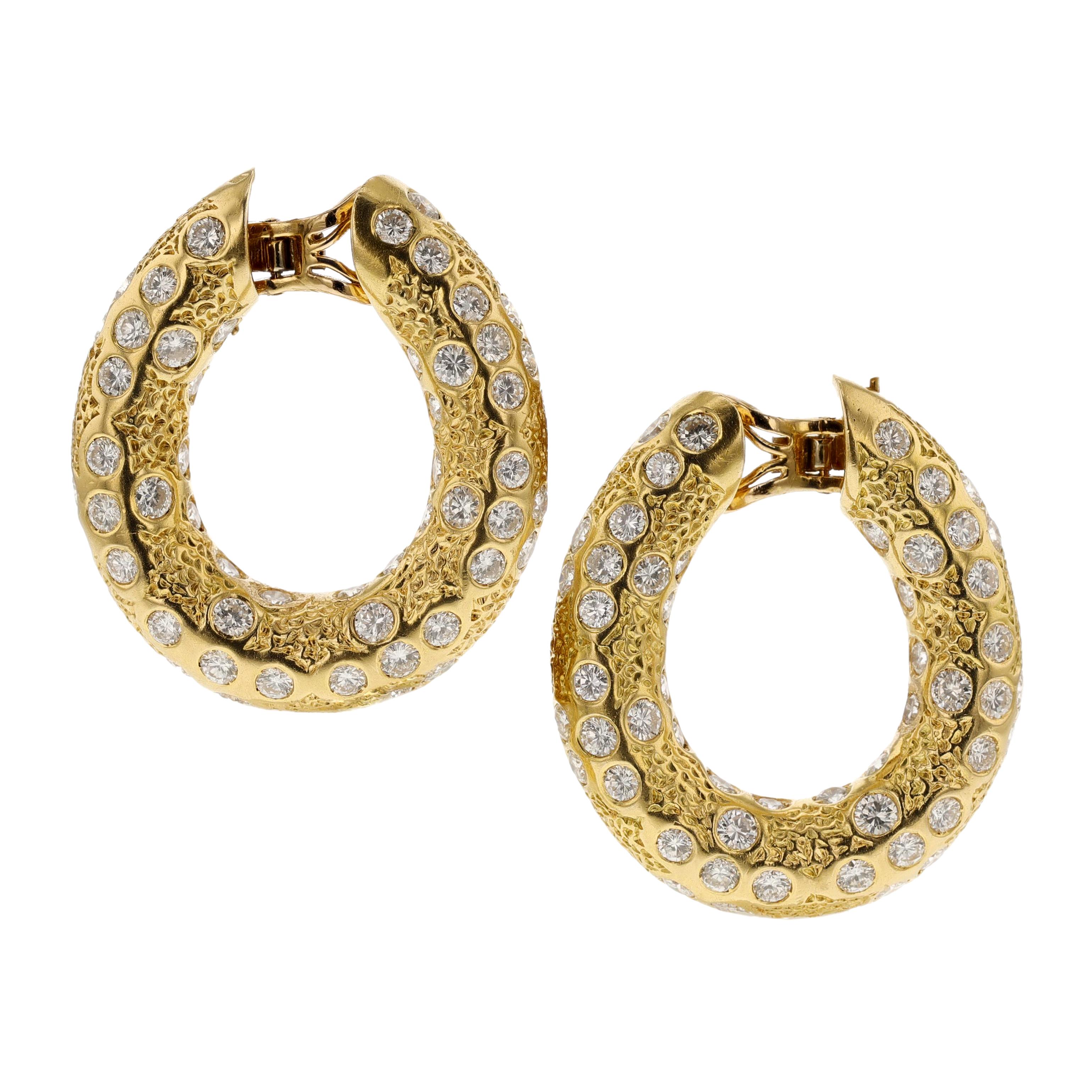 A pair of Van Cleef & Arpels (Péry et Fils) Diamond and Gold Hoop Earrings made in 18k yellow gold with French marks, circa 1970s. The diamonds weigh appx. 11-12 carats. The dimensions are 3.7 x 3.2 cm and weigh 29.67 grams. They are clip-ons and
