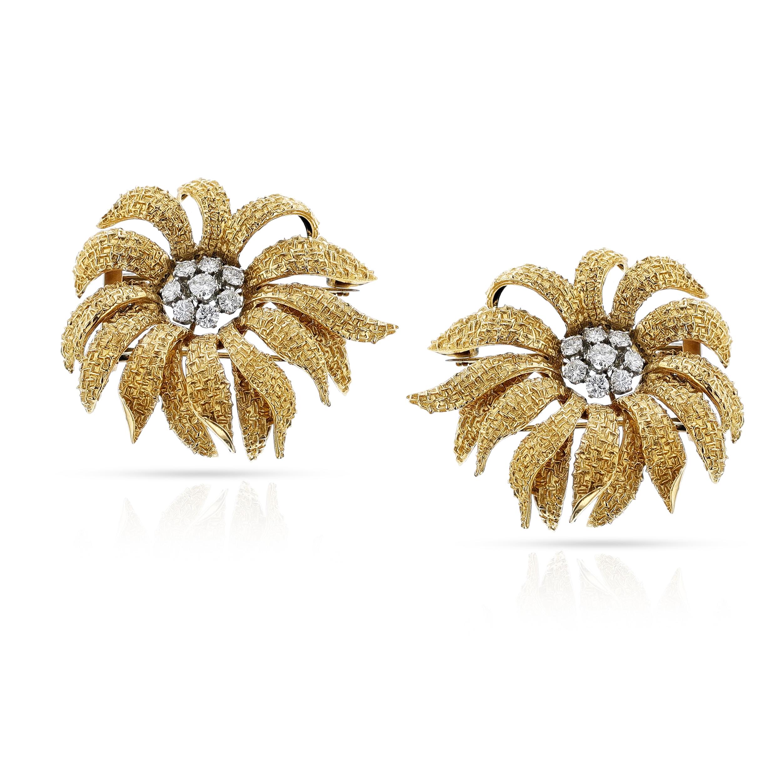 A pair of Van Cleef & Arpels Flower Brooches by Pery et Fils made in 18k Gold and with Diamonds. Each flower is designed with textured gold petals with diamonds. Paris, Circa 1980. Numbered. The dimensions are 1.75 x 1.50 inches, signed Van Cleef
