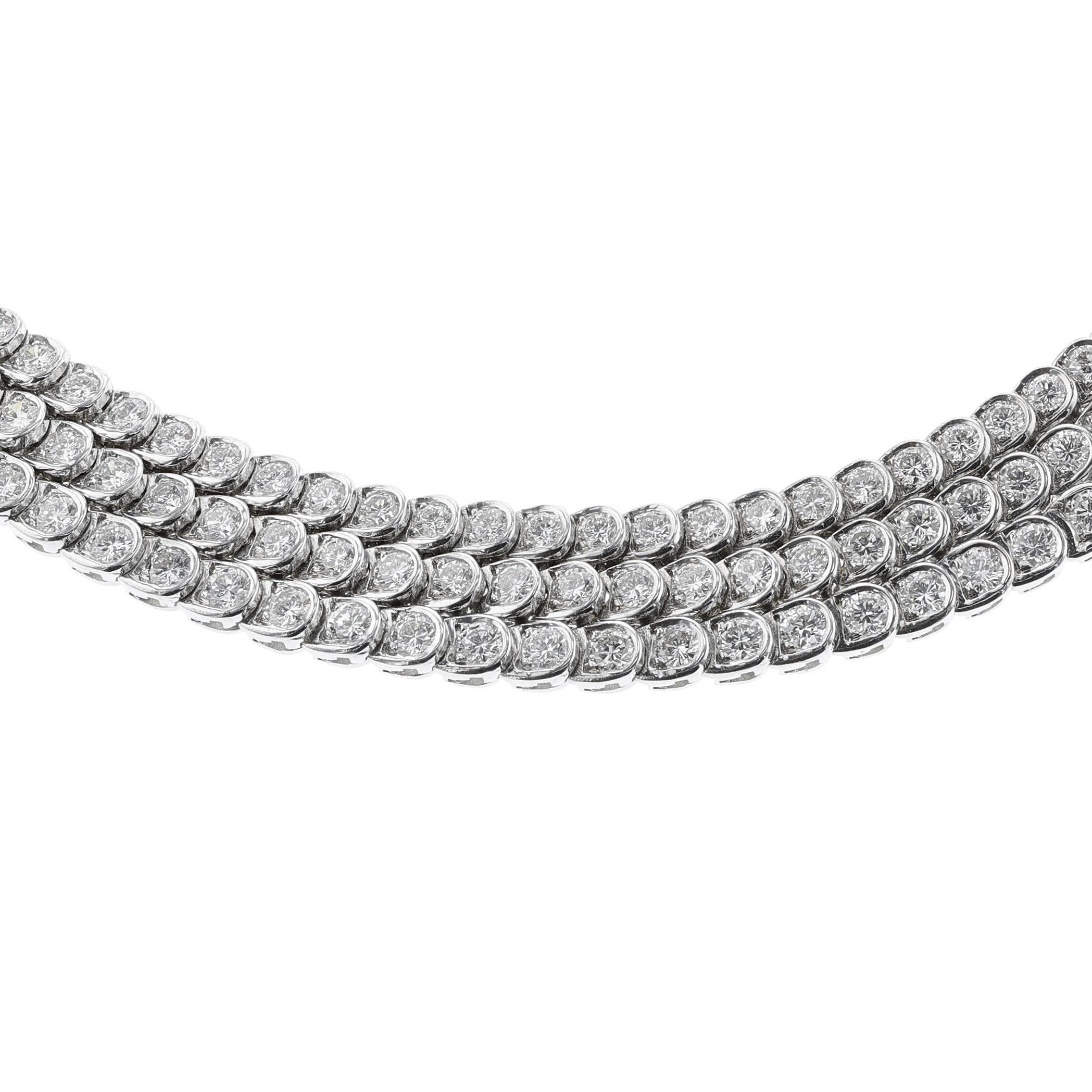 A Van Cleef & Arpels Three Line Diamond Necklace made in 18k White Gold. Signed Van Cleef & Arpels, makers mark- Pery et Fils, Numbered. Circa 1955. There are appx. 276 round diamonds weighing appx. 27-28 carats. The color is F-G, and the clarity is