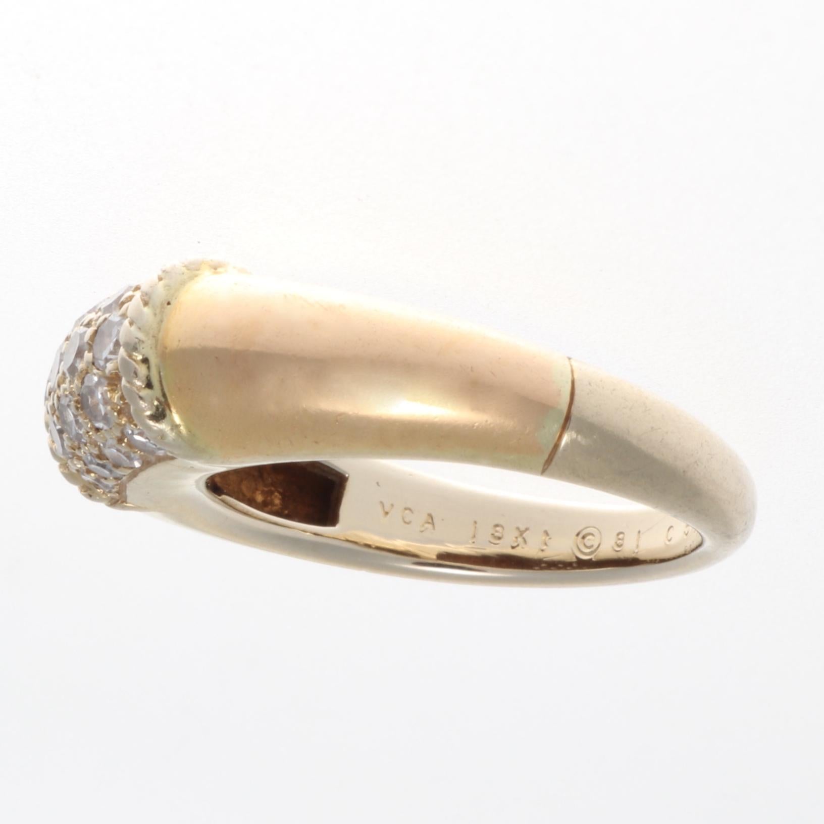 Elegance from the French designers at Van Cleef & Arpels. This ring features 18 round brilliant cut diamonds weighing approximately 0.45 carats that are E-F color, VVS clarity. Perfectly balanced by smooth flowing lines of glistening 18k yellow
