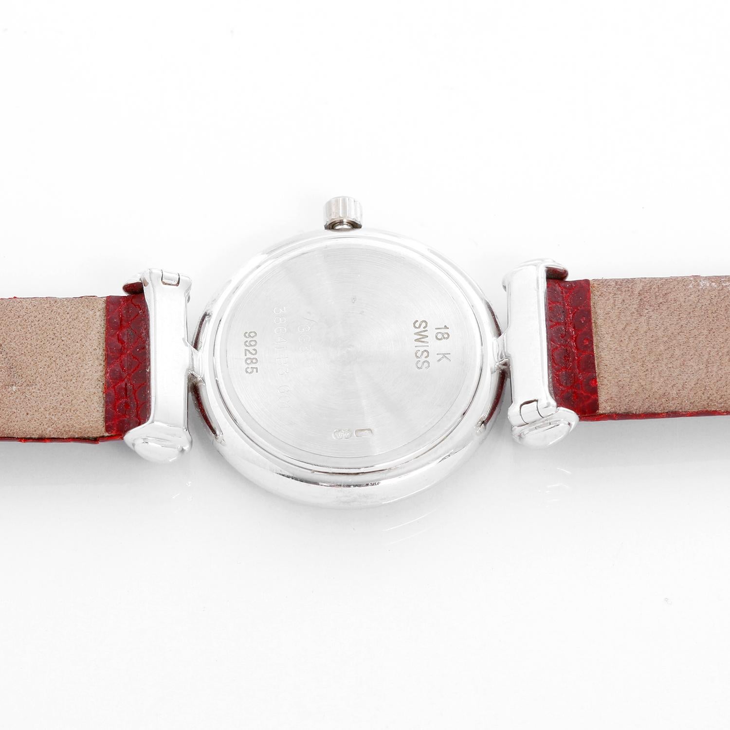 Van Cleef & Arpels Pierre White Gold Ladies Watch - Quartz. 18K white gold with diamond bezel ( 24 mm ). Ivory dial with stick and roman numerals. Red lizard strap with tang buckle . Pre-owned with Van Cleef & Arpels pouch.
