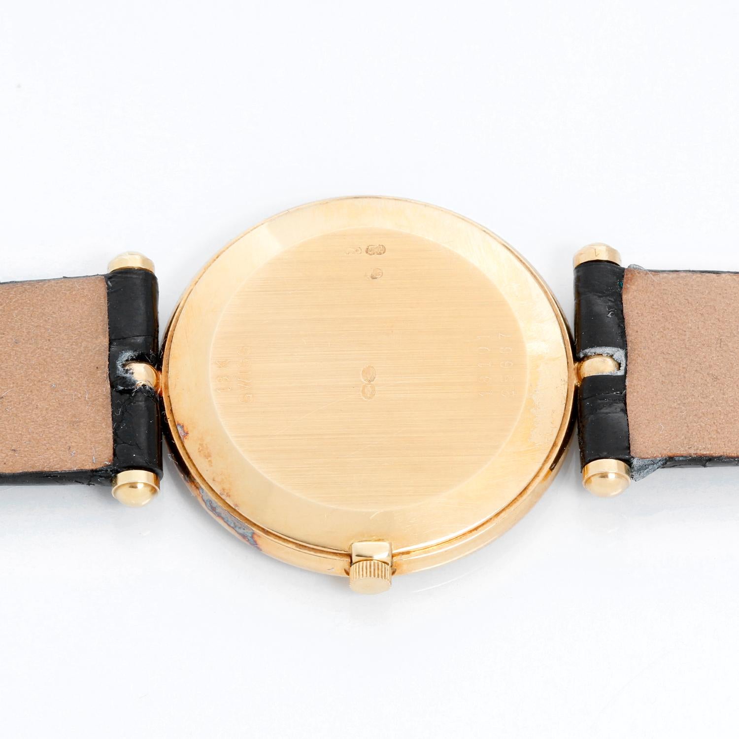 Van Cleef & Arpels Pierre Yellow Gold Ladies Watch - Quartz. 18K Yellow gold ( 30 mm ) . Silvered champagne dial with stick and roman numerals . Black Alligator Strap with Tang Buckle. Pre-owned with custom box.