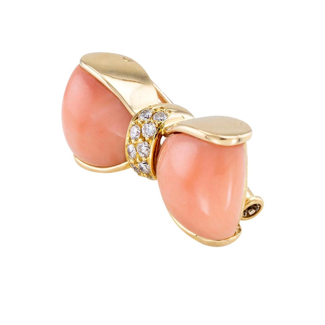 Van Cleef & Arpels pink coral, diamond, and yellow gold bow brooch circa 1990.

The facts you want to know are listed below.  Read on.  It is all remarkably short, simple, and clear.

Contact us right away if you have additional questions. 

We are