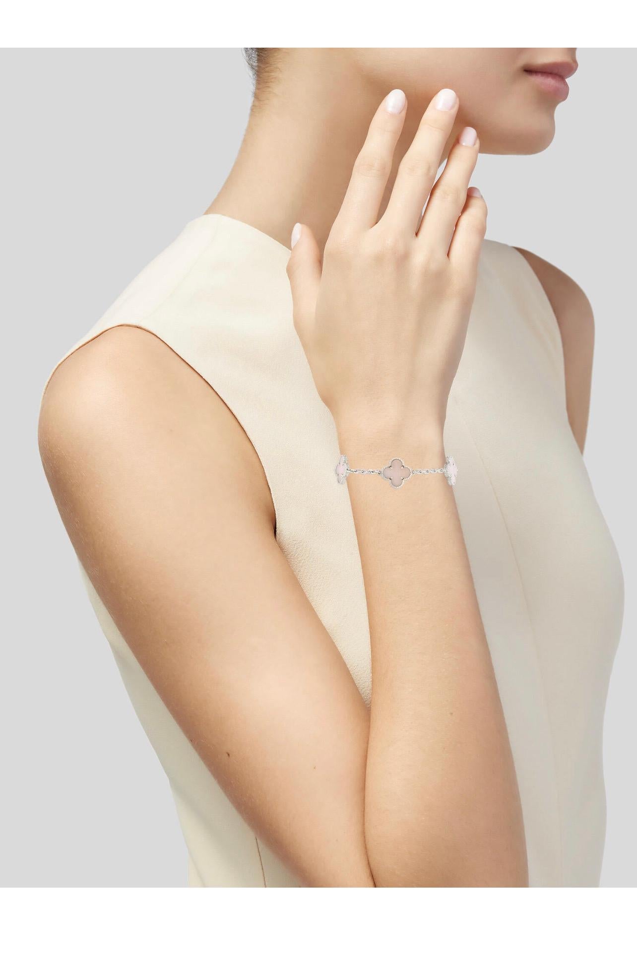 Original Van Cleef 
18k White Gold
5 Motifs 
Pink Opal 
