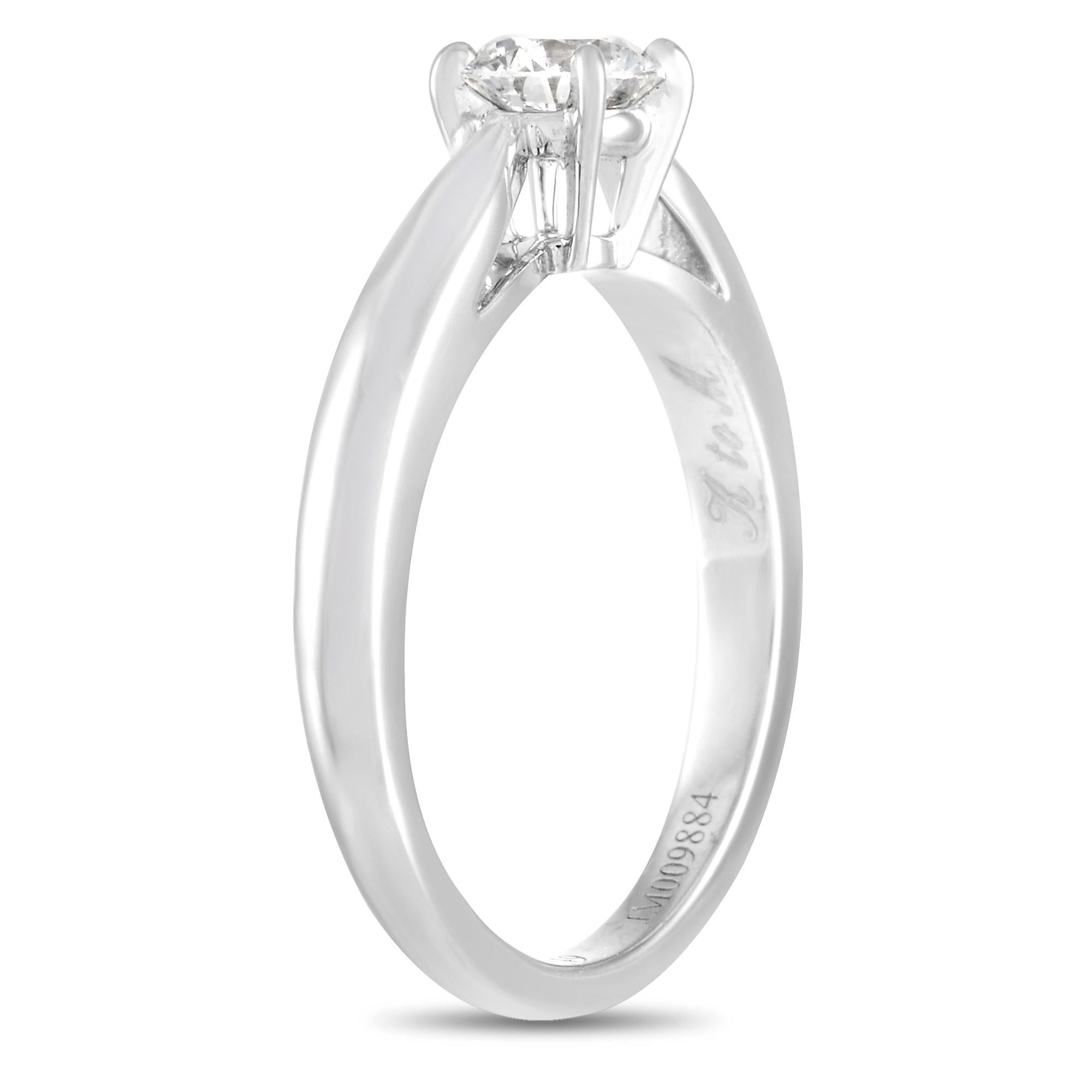 This timeless Van Cleef & Arpels Platinum 0.40 ct Diamond Engagement Ring is the epitome of the classic diamond ring. The ring is made with Platinum and is set with a single round-cut 0.40 carat diamond of E color and VVS2 clarity that is held in