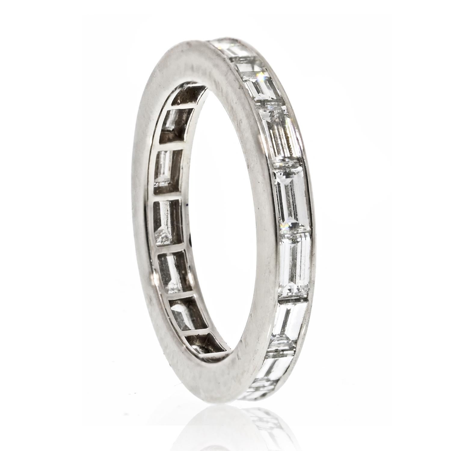 This Van Cleef & Arpels eternity band is an exquisite piece of jewelry that showcases the brand's commitment to quality and craftsmanship. Made from Platinum, the band features a total of 2.50 carats of baguette cut diamonds that run horizontally
