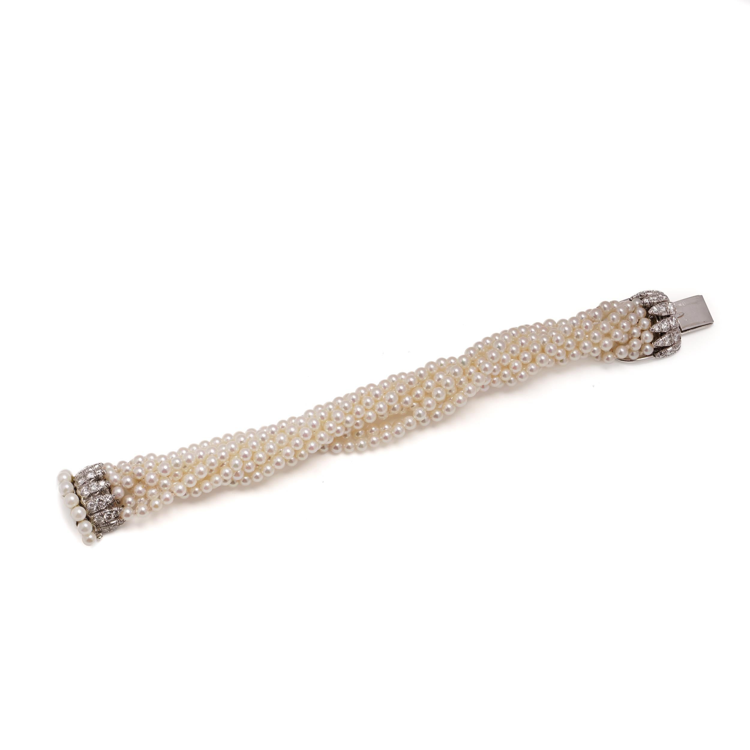 A stunning mid-20th-century bracelet by Van Cleef & Arpels, showcasing the maison’s signature refinement in both form and function. This elegant piece features nine rows of lustrous, near-round cultured pearls, each approximately 4 mm in diameter,