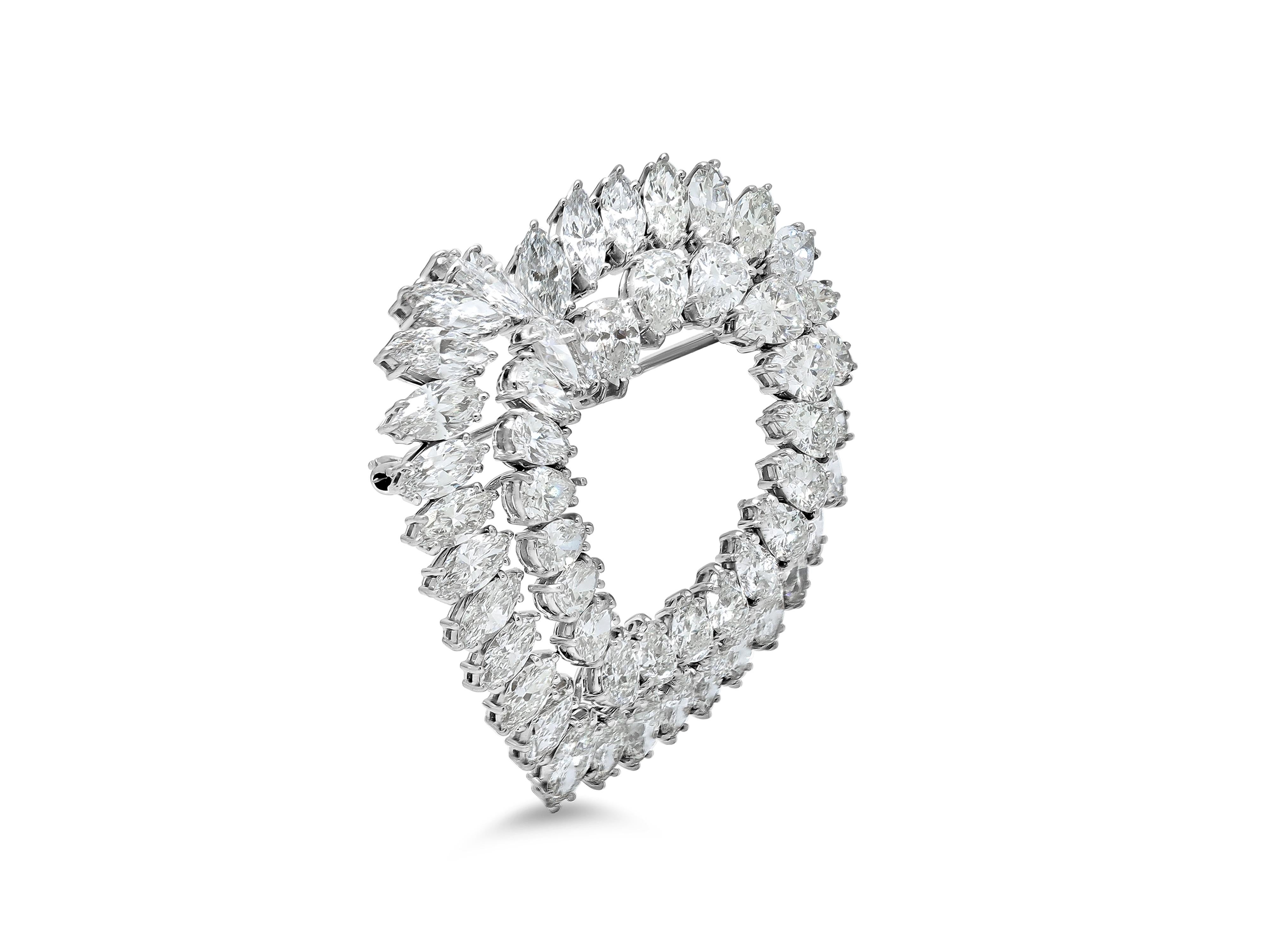 A stunning Van Cleef & Arpels heart-shaped brooch crafted in platinum, set with approximately 23.50 carats of colorless pear-shaped and marquise diamonds. Weighing 28.8 grams, this exquisite piece embodies the timeless elegance and exceptional