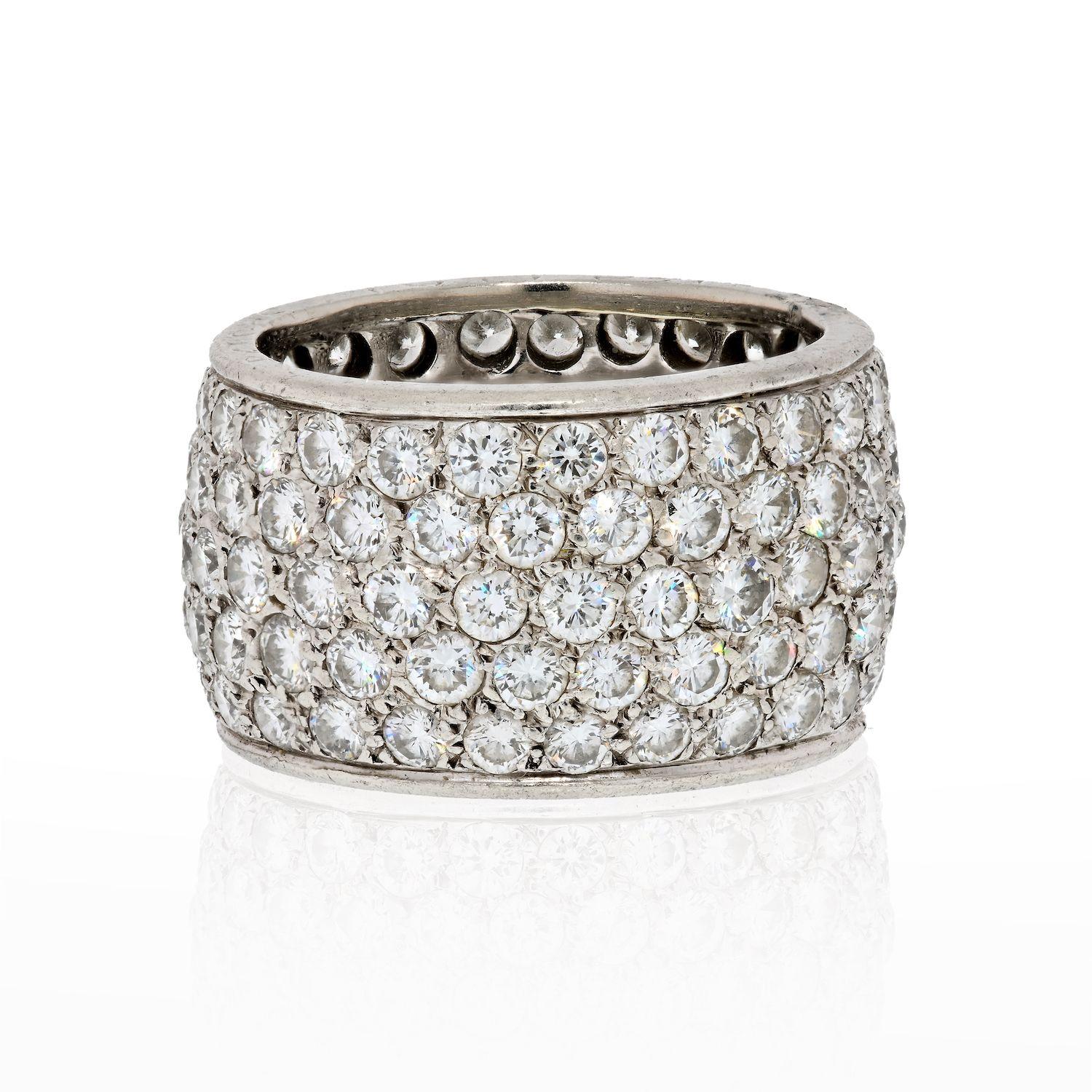This classic Van Cleef & Arpels eternity band is made in platinum and pave-set with 5 rows of sparkling brilliant-cut round diamonds of an estimated 6 carats. Elegant and timeless. 
The ring is 12mm wide.
Comes with the VCA box. 