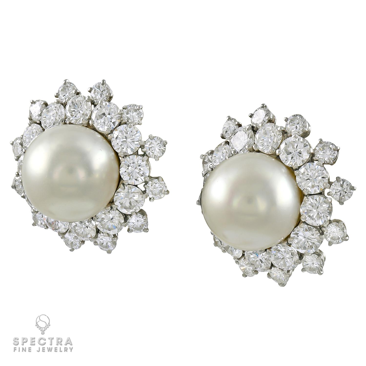The only thing more captivating than a perfectly round, smooth, lustrous pearl is heightened by a scattered diamond halo. These Van Cleef & Arpels Vintage Pearl Diamond Halo Button Earrings, made in NY circa 1980s, feature the utterly elegant and