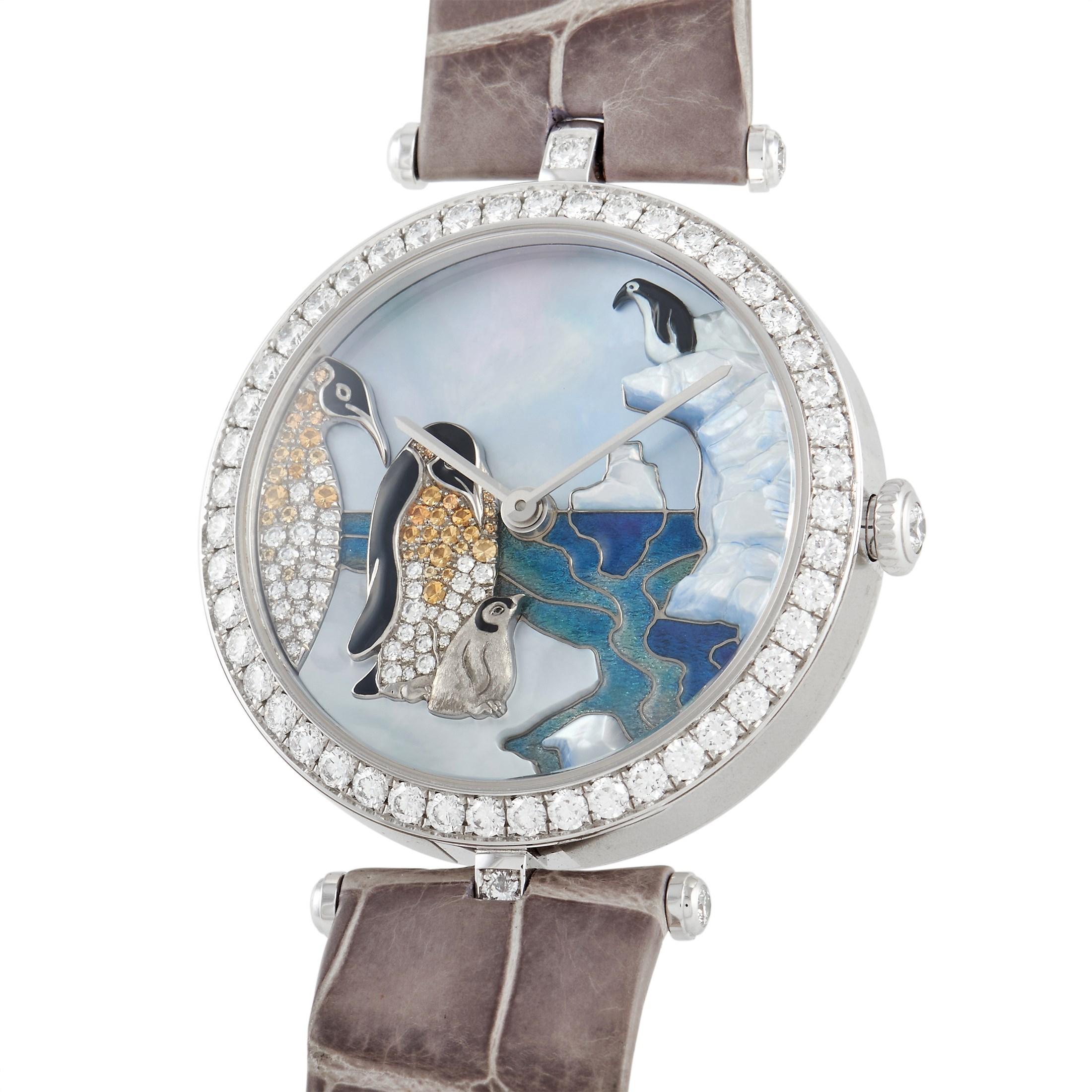 From circa 2011, this Van Cleef & Arpels Poetic Polar Landscape Penguin Ladies Watch HH35319 features an extraordinary dial. Set with a numberless Mother of Pearl dial background is a penguin landscape in enamel with diamond accents. Silver-tone