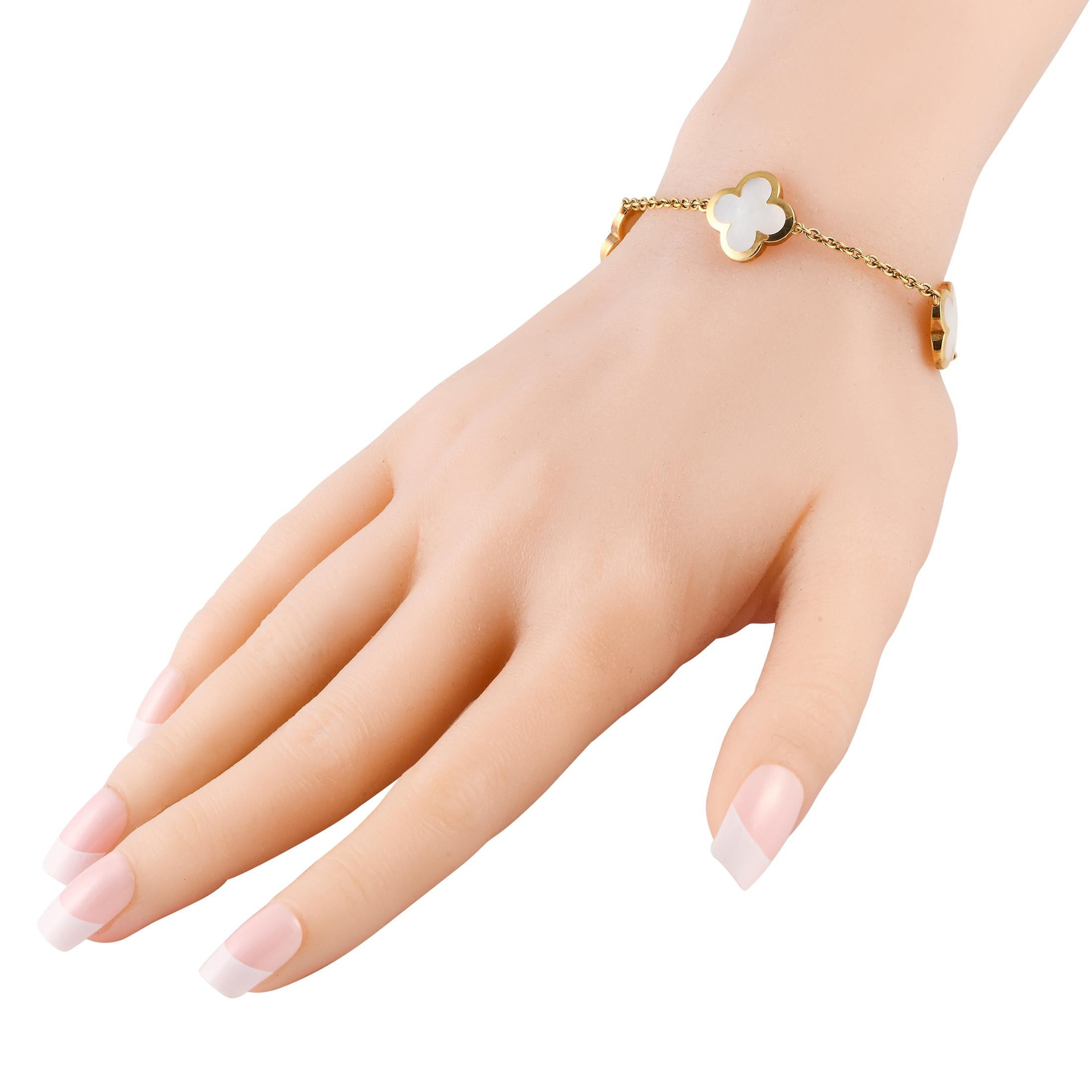This sophisticated Van Cleef & Arpels Alhambra bracelet will never go out of style. An opulent 18K Yellow Gold chain is beautifully accented by a series of the brand’s iconic clover-shaped motifs, which are elevated by Mother of Pearl accents. This