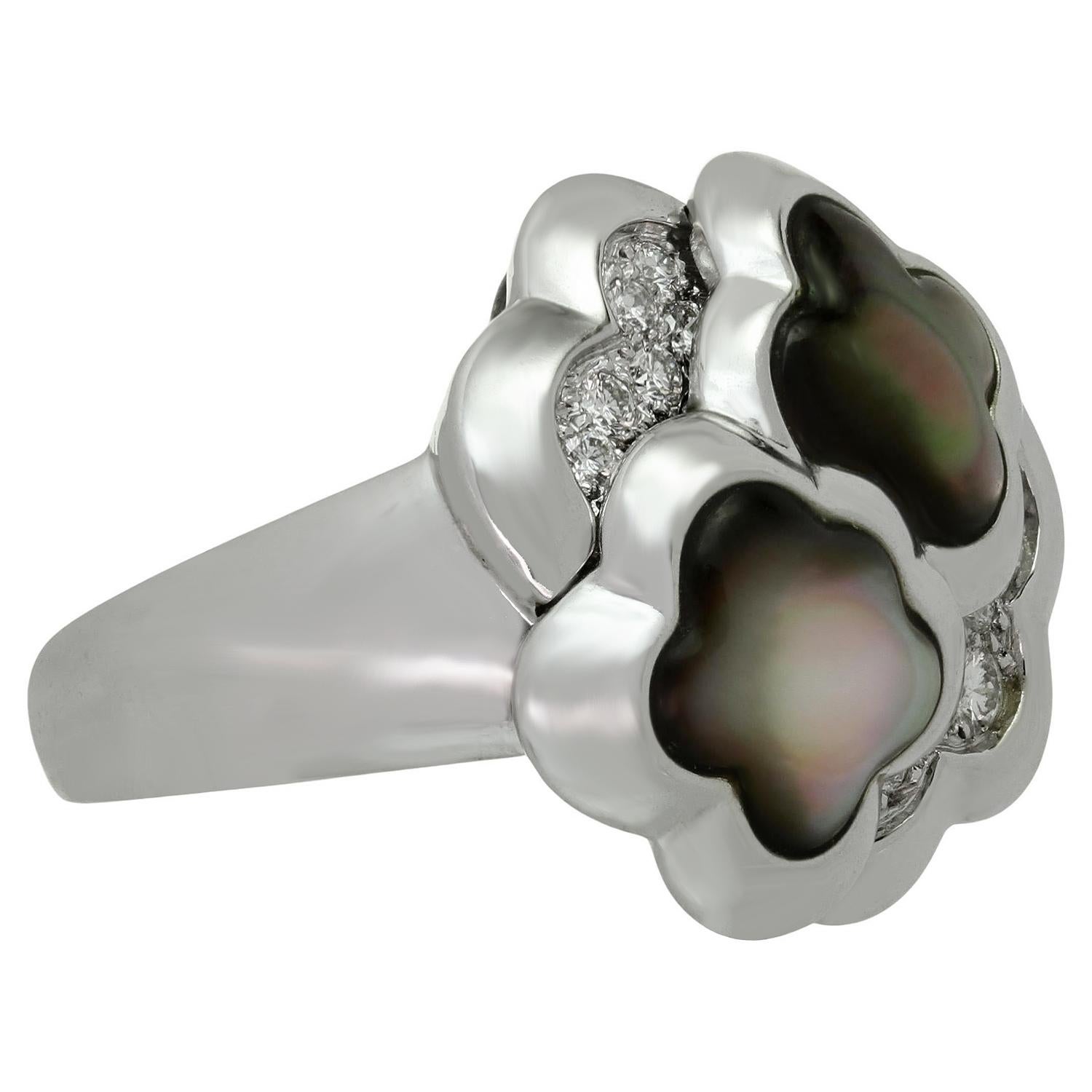 This elegant Van Cleef & Arpels ring from the iconic Pure Alhambra collection features a 2 lucky clover design crafted in 18k white gold and set with iridescent gray mother-of-pearl. Made in France circa 1990s. Measurements: 0.78