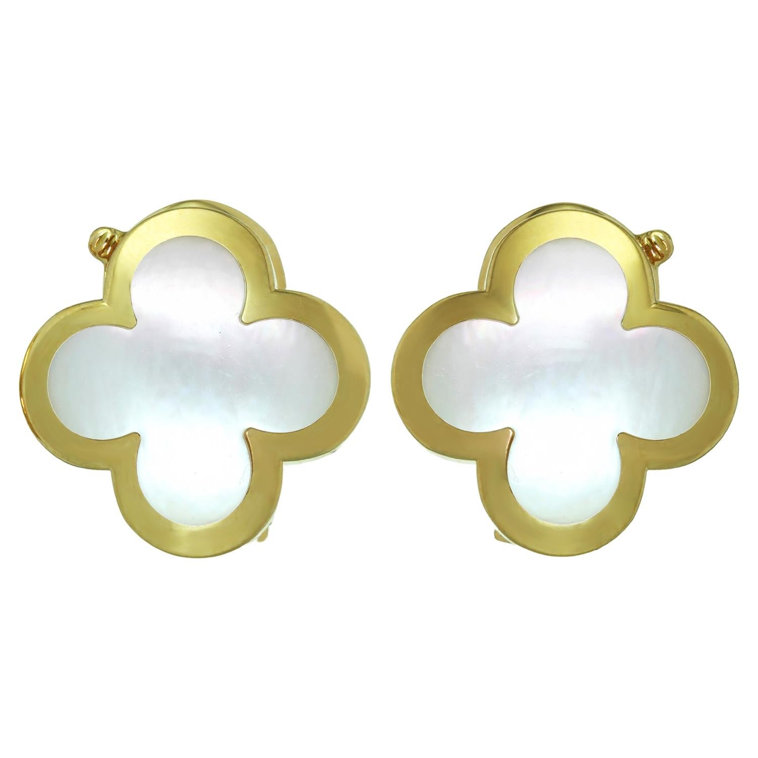 These fabulous Van Cleef & Arpels earrings from the iconic Pure Alhambra collection feature the shape of lucky clovers crafted in 18k yellow gold and accented with mother-of-pearl. The mother-of-pearl is domed to give it an incredible luster from