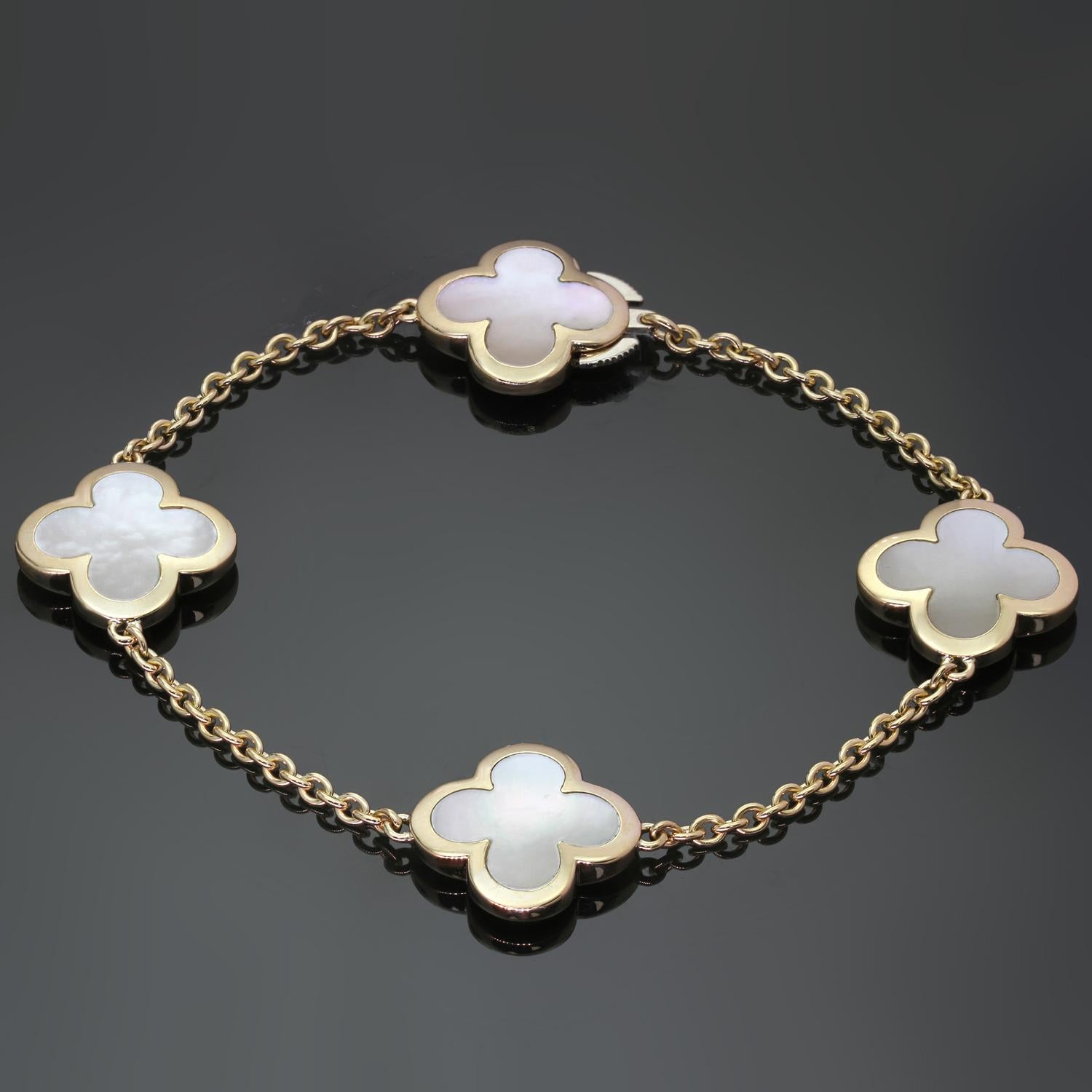This fabulous Van Cleef & Arpels bracelet from the Pure Alhambra collection is crafted in 18k yellow gold and features 4 lucky clover motifs inlaid with mother-of-pearl. Completed with a concealed clasp. Made in France circa 2010s. Measurements: